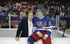Joe Cure, right, paused during filming "Miracle" with actor Noah Emmerich, who portrayed Team USA assistant coach Craig Patrick.