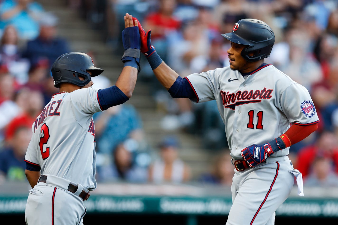 Jorge Polanco celebrates with Luis Arraez after hitting a two-run home run against the Guardians during the third inning