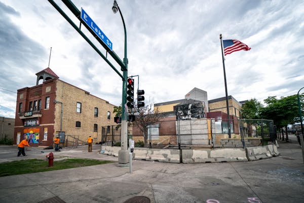 The burned out Third Precinct at the corner of E. Lake Street and Minnehaha Avenue in Minneapolis, seen on July 16. Voters could face competing ballot