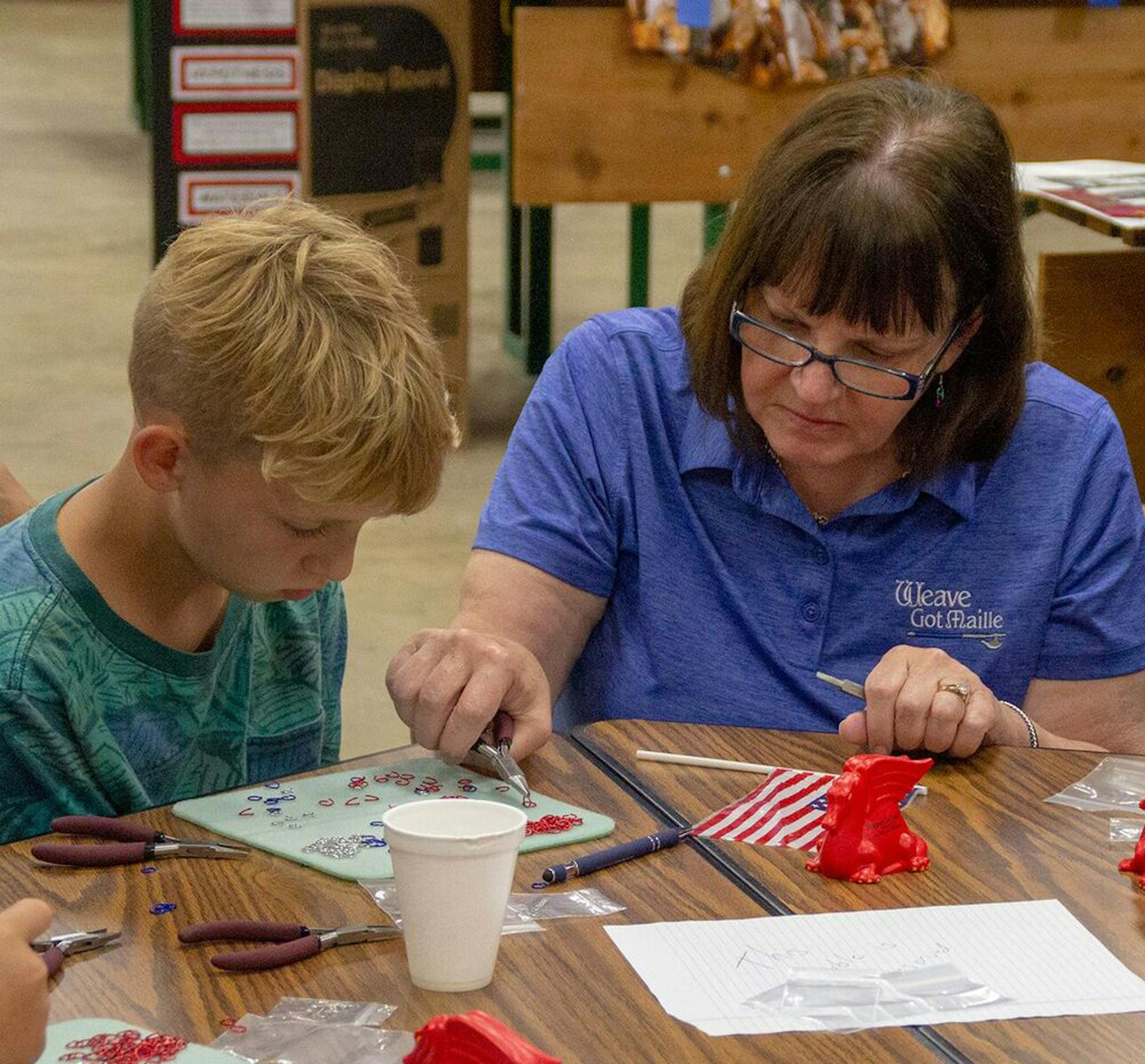 Business owner Edie Ramstad of Weave Got Maille in Ada, Mn., works with a couple prospective employees. ORG XMIT: MIN1807031607451120