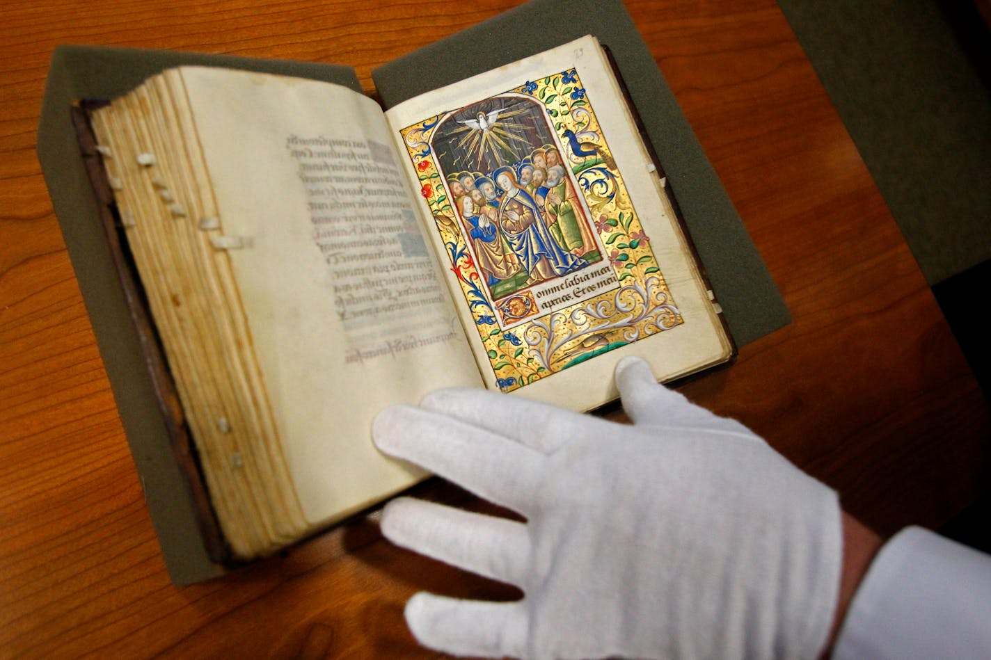 Scott Gwara, a professor at the University of South Carolina, shows a 15th century Book of Hours that the university acquired. (Gerry Melendez/The State/MCT)