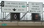 The signs for MnPass lanes on Interstate 35W in Bloomington.