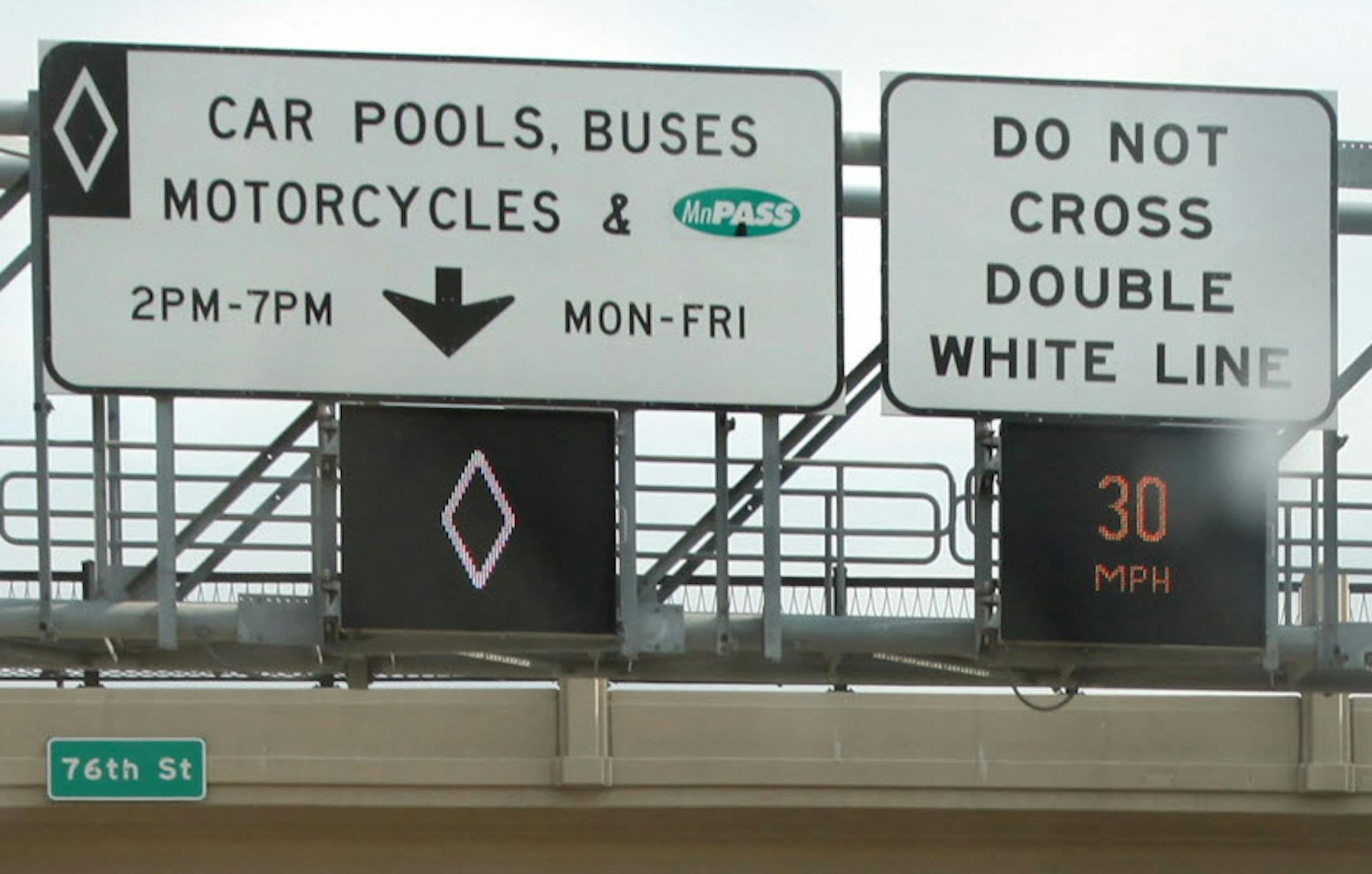 The signs for MnPass lanes on Interstate 35W in Bloomington.