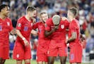 Teammates celebrate with USA forward Gyasi Zardes (9), second from right, after he scored a goal that deflected in off of his face in the June 18 matc