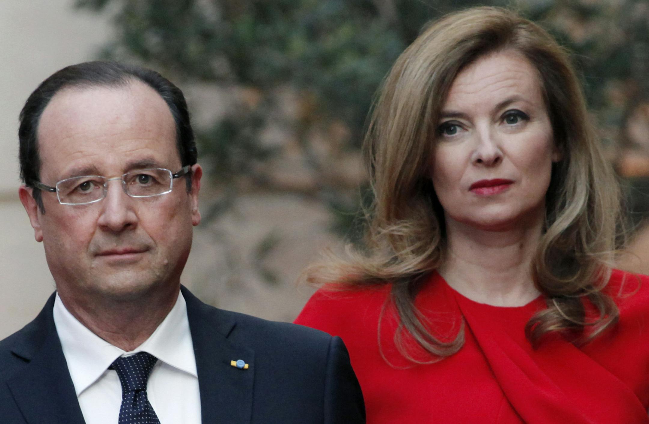 FILE - In this Tuesday, May. 7, 2013, file photo, French President Francois Hollande, left, and his companion Valerie Trierweiler arrive for a state dinner at the Elysee Palace, in Paris as part of Polish President Bronislaw Komorowski's two-day visit to France. The woman considered France's first lady has been hospitalized after a report that the president is having an affair with an actress. Valerie Trierweiler's chief of staff, Patrice Biancone, confirmed Sunday that the 48-year-old journalis