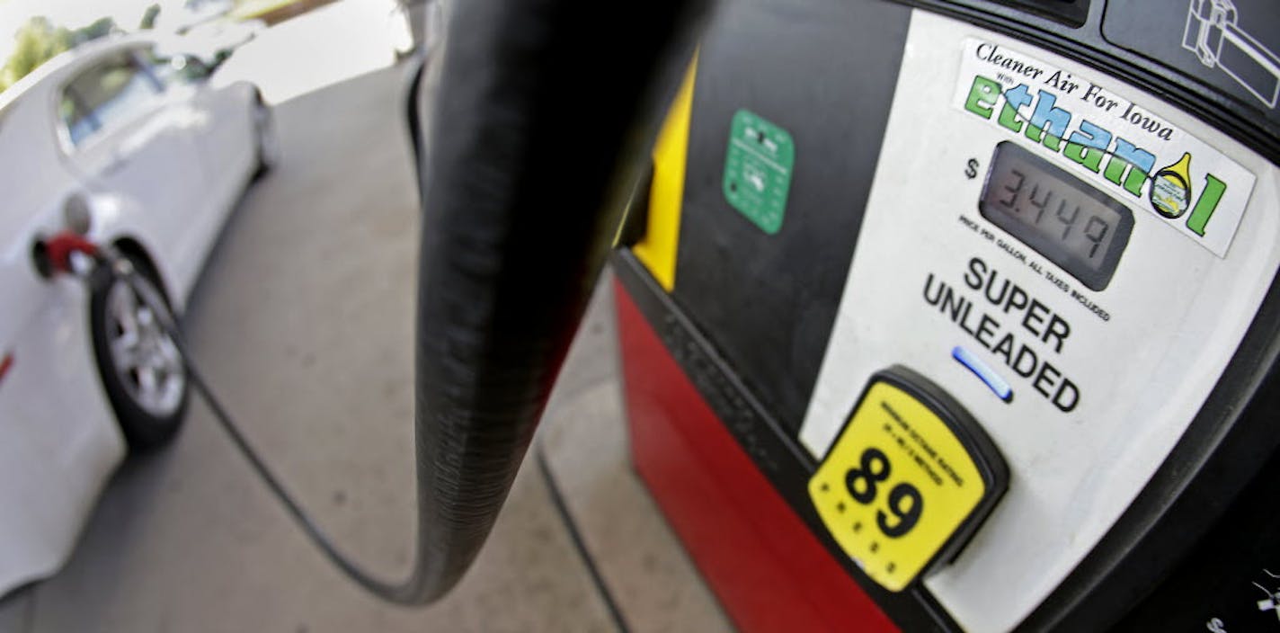 A motorist fills up with gasoline containing ethanol in Des Moines.