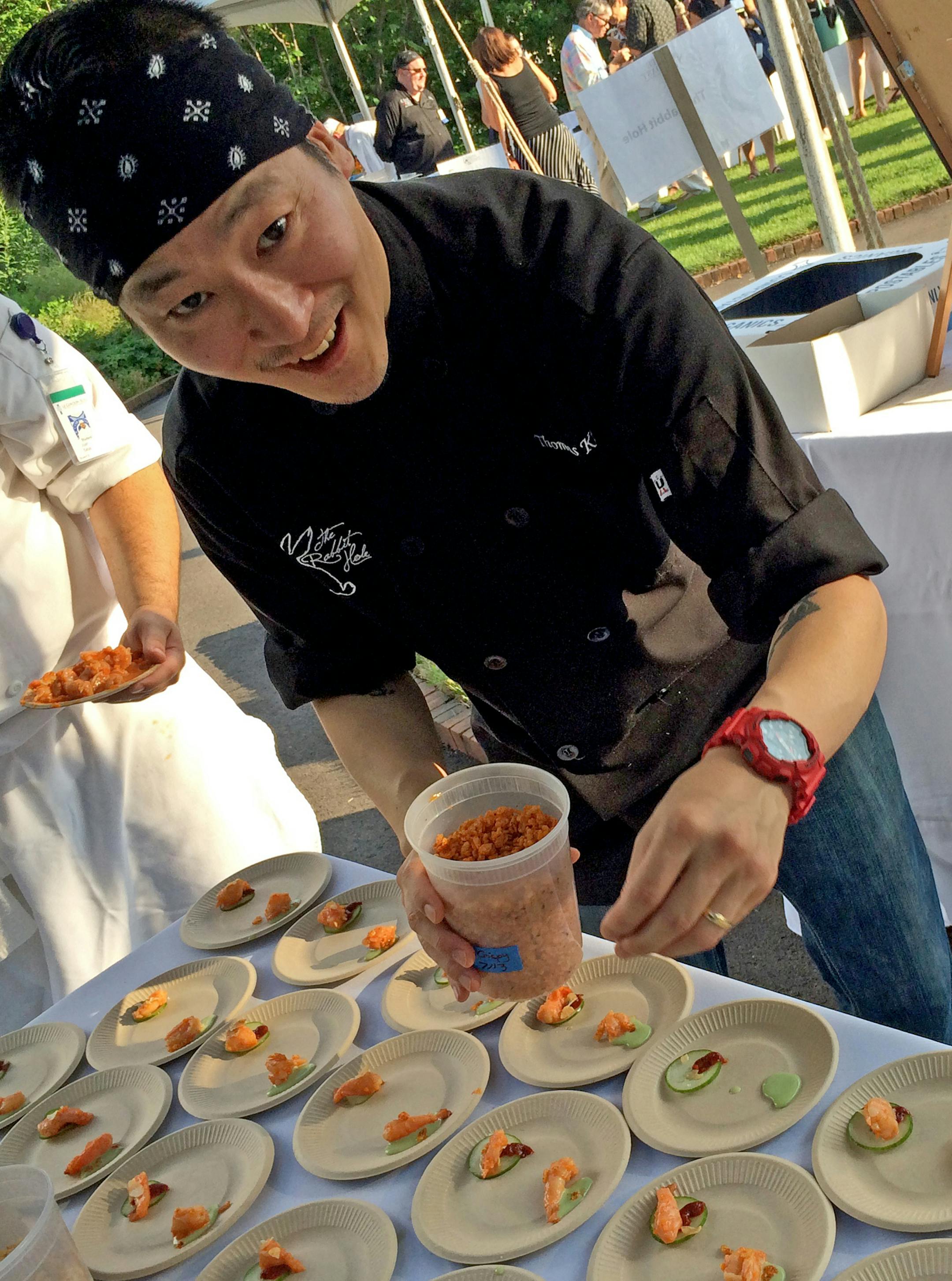 Minnesota Landscape Arboretum made the perfect setting for the annual Taste and Toast fundraising event. Thomas Kim of the Rabbit Hole puts the finishing touches on an appetizer.