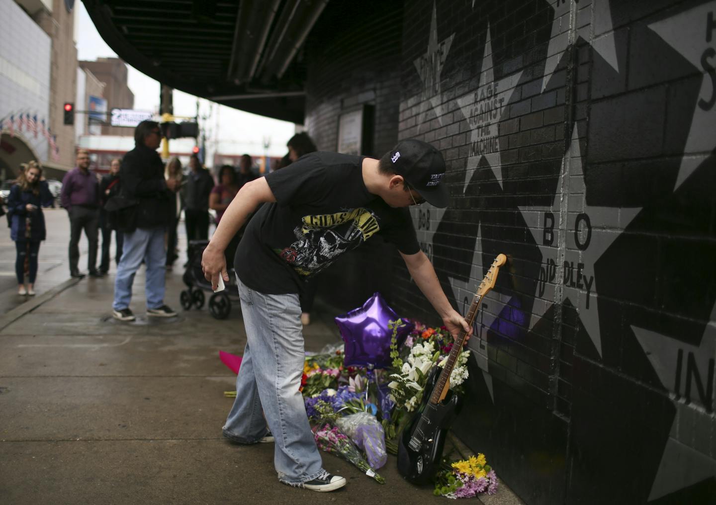 Christopher LaCroix of Minneapolis left a guitar near Prince's star at First Ave. Tuesday afternoon. "It's his now," he said.