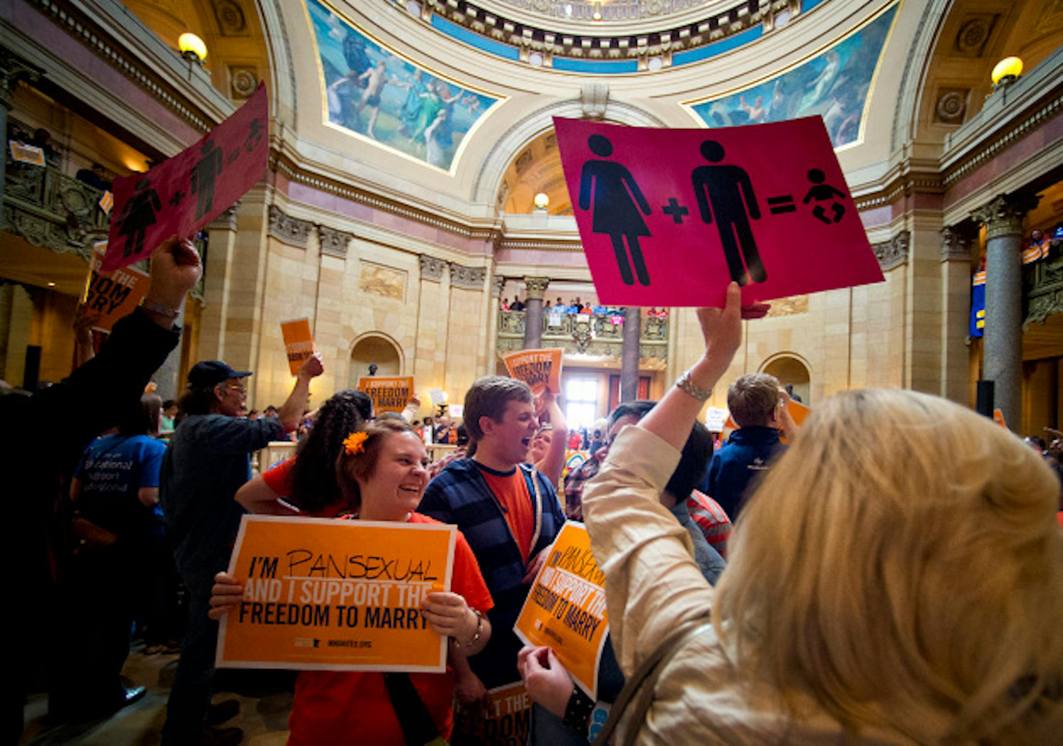 Opposing sides of the marriage debate passed in the Rotunda.  Marriage debate will start in the Senate.  Monday, May 13, 2013    ]   GLEN STUBBE * gstubbe@startribune.com