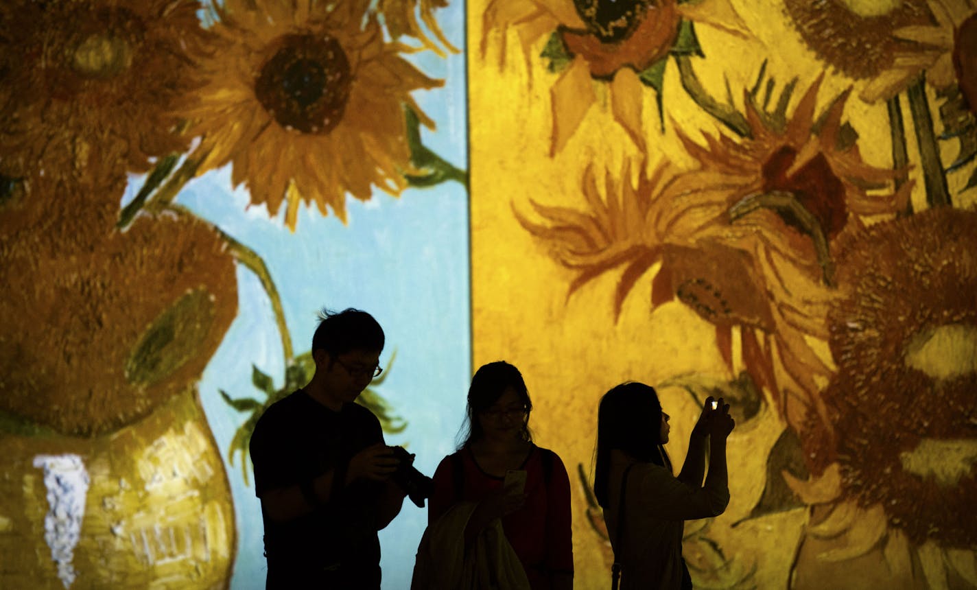 In Clare Clark's novel, a trove of Van Goghs are found to be forgeries. In this photo, a Van Gogh painting is projected on a wall during an exhibit in Beijing.