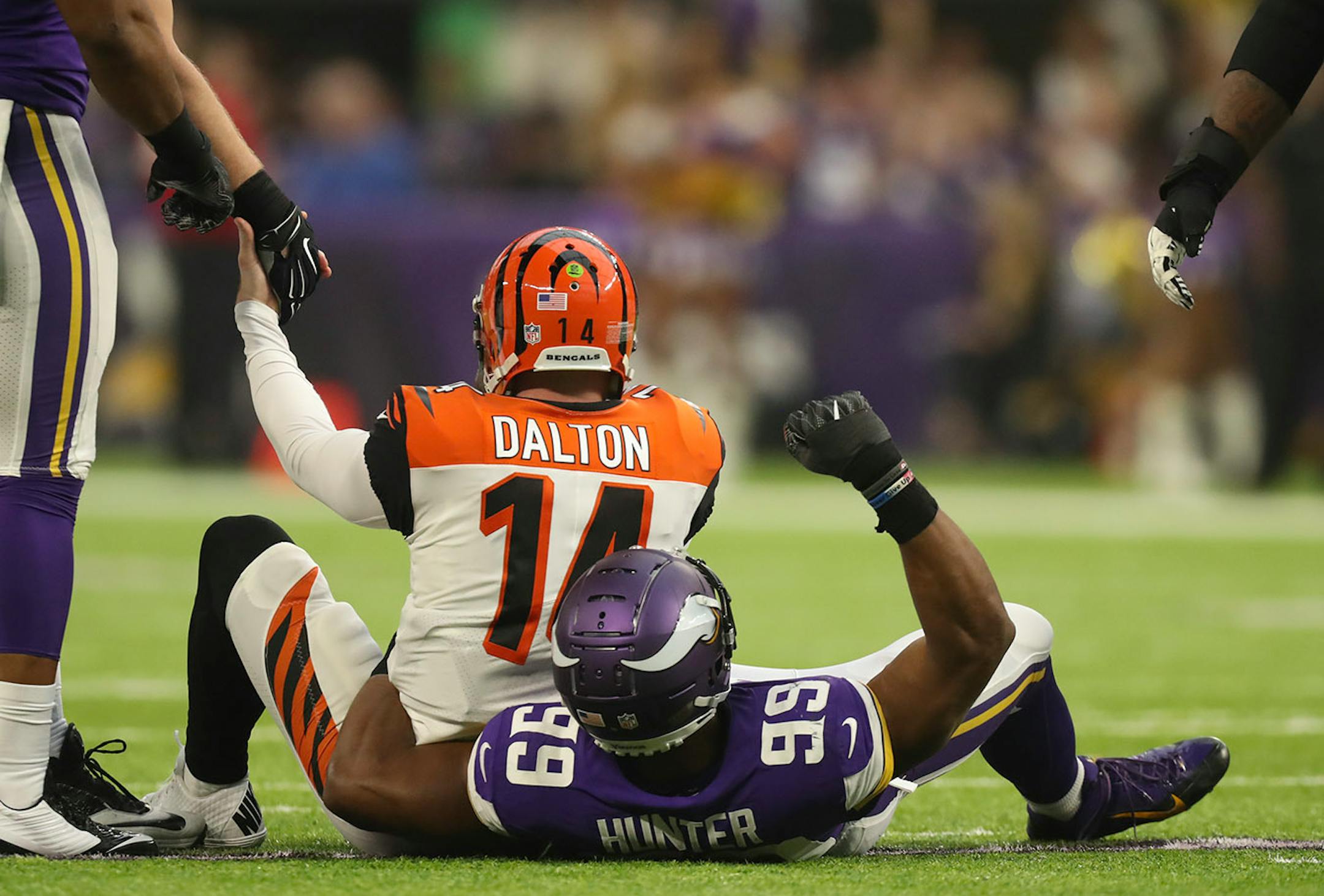 Minnesota Vikings defensive end Danielle Hunter (99) pumped his first after he sacked Cincinnati Bengals quarterback Andy Dalton (14) for a nine yard loss in the second quarter.