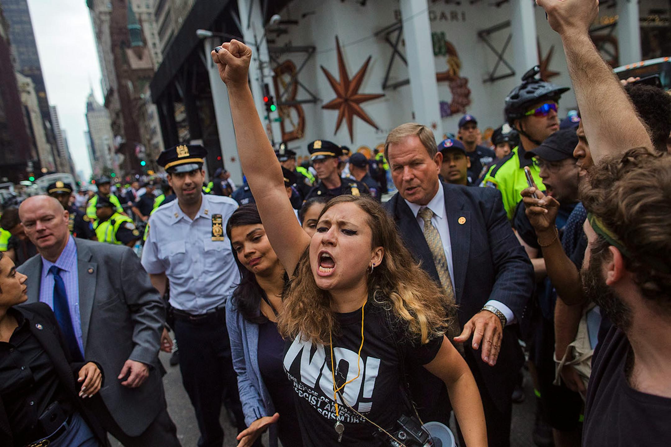 Protestors gather near Trump Tower in New York, Monday, Aug. 14, 2017. Thousands of protesters and heavy security were ready to greet President Donald Trump as he headed for his home in the city on Monday for the first time since his inauguration.