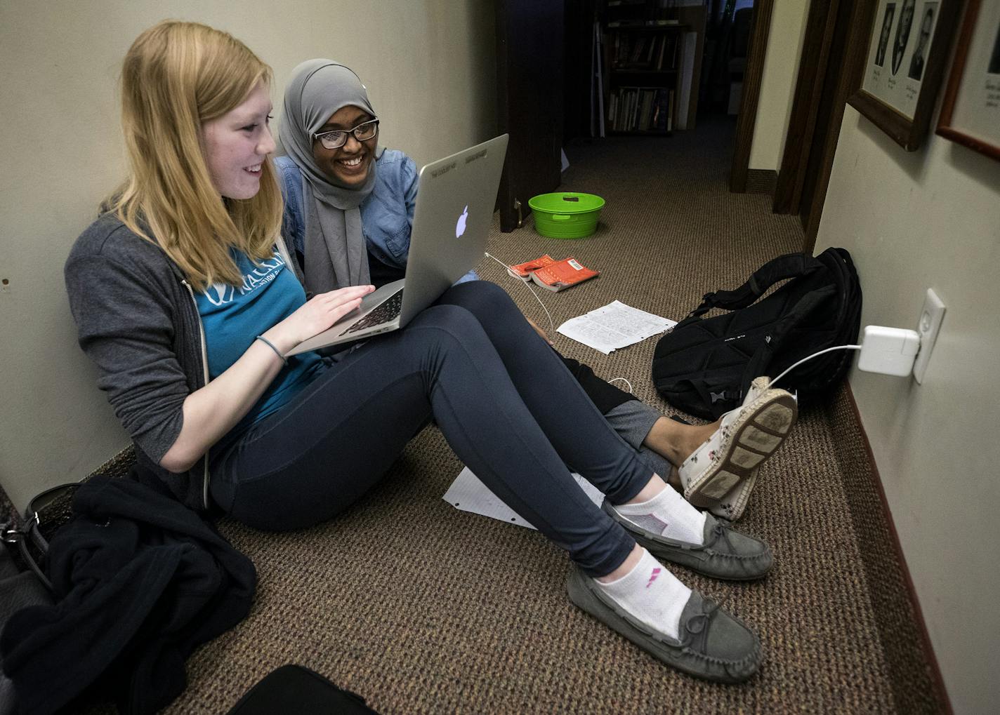 Kaila Kemnetz, 20, helped Sabrina Mohamed, 16, with her homework at Trinity Lutheran in Minneapolis.