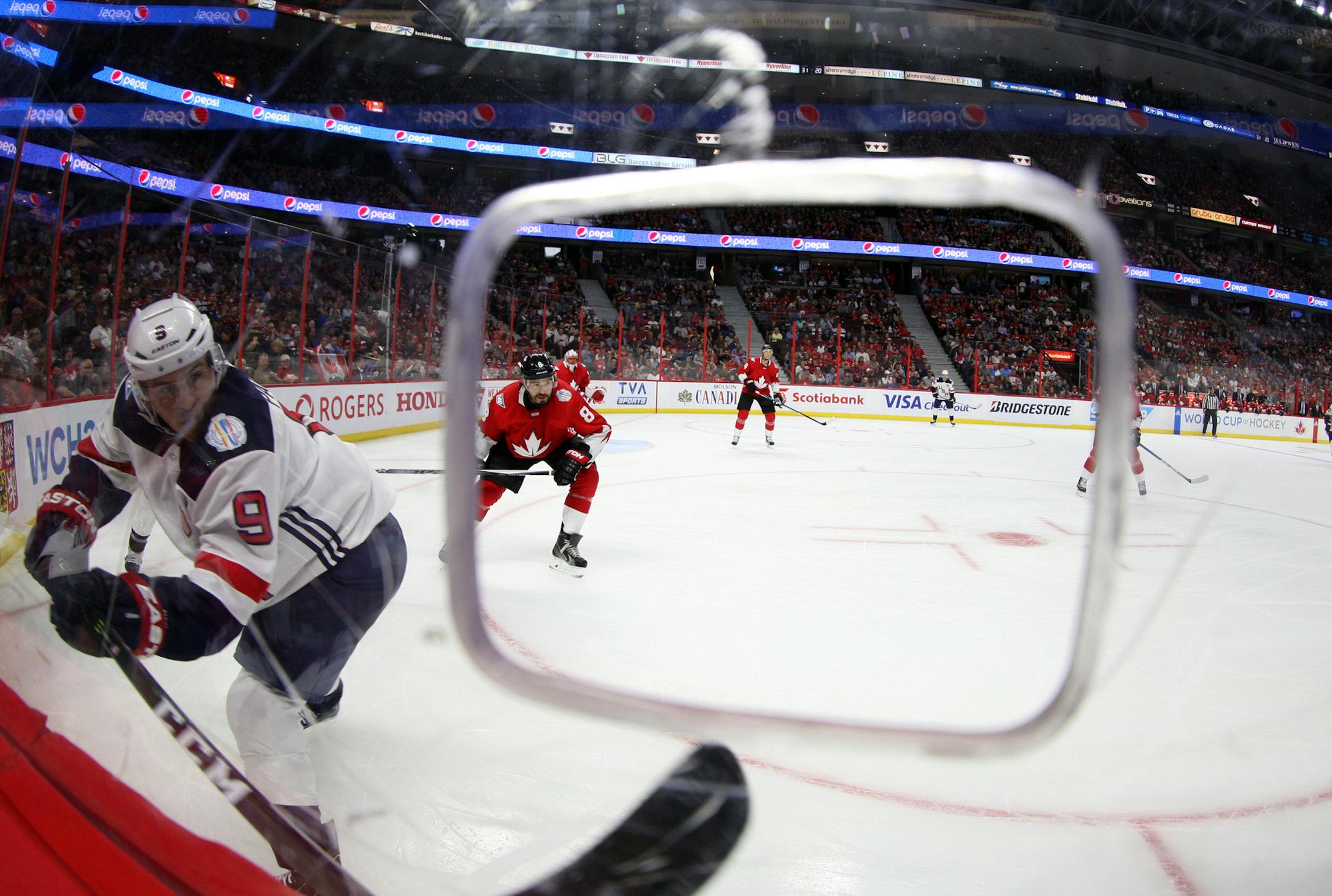 10 September 2016: Zach Parise (9) fires the puck around the boards to the defence during World Cup of Hockey Pre-Tournament action at Canadian Tire Centre in Ottawa, On. (Photo by Jay Kopinski/Icon Sportswire) (Icon Sportswire via AP Images) ORG XMIT: 265732