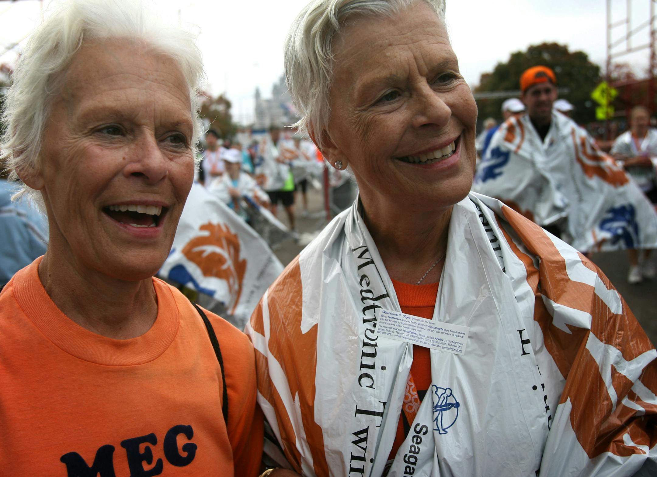 Twin sisters Meg Crandall, left, and Beth Freitas, both of Michigan, talked about their Twin Cites Marathon experiences. The sisters, 61, are both breast cancer survivors.
