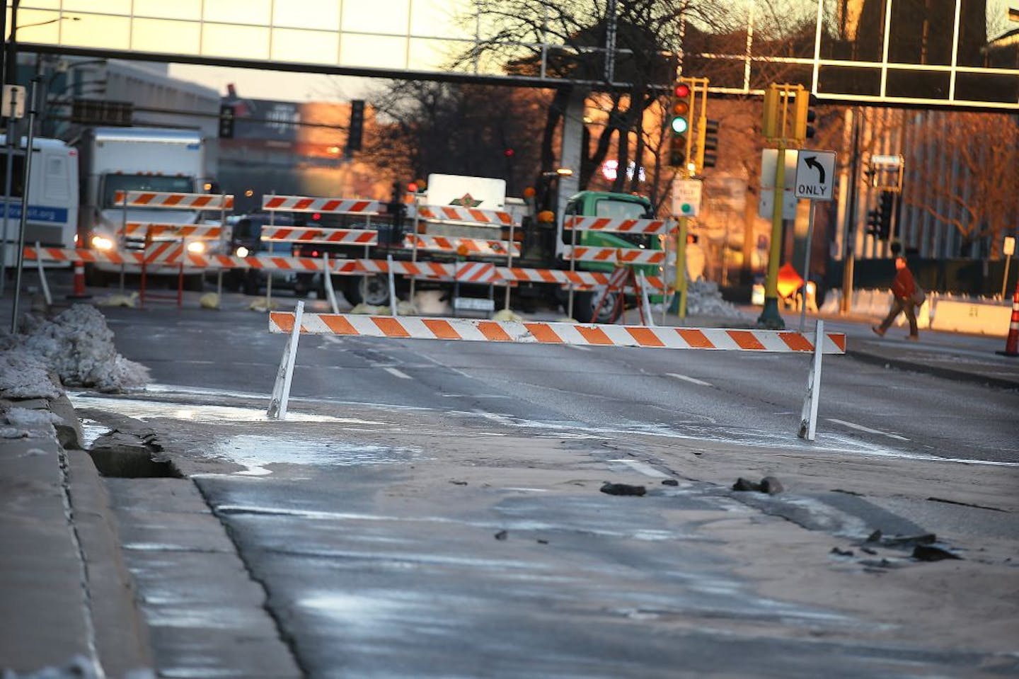 The street between S. 2nd Avenue and S. 3rd Avenue buckled after a water line break on Washington Avenue South, Friday, December 4, 2015 in downtown Minneapolis, MN.