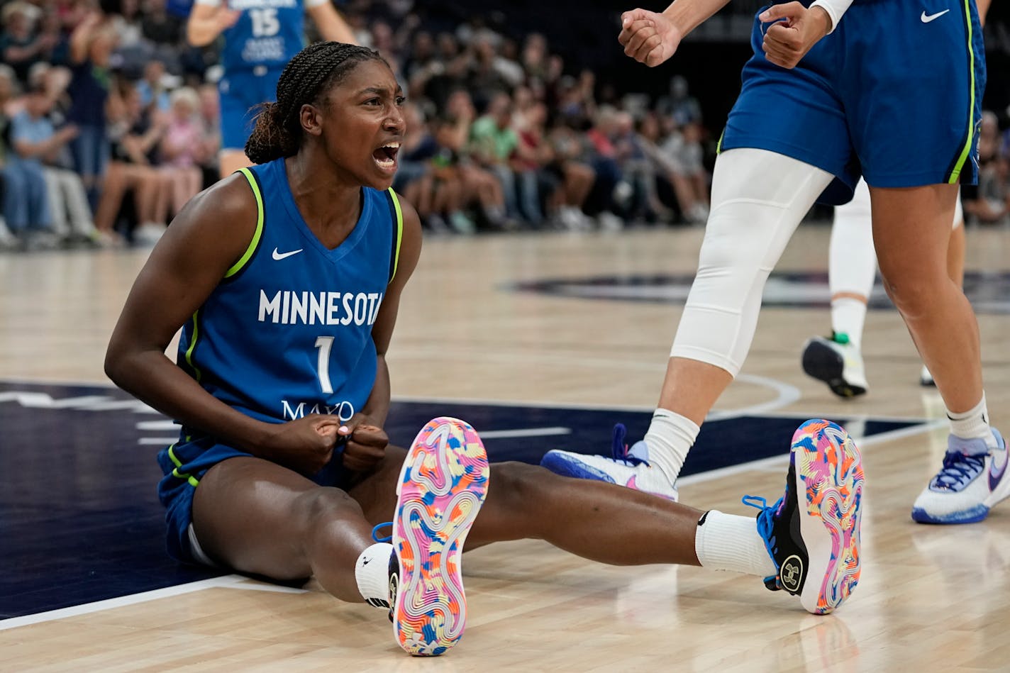 Minnesota Lynx guard Diamond Miller (1) celebrates after making a basket while fouled during the second half of a WNBA basketball game against the Seattle Storm, Tuesday, June 27, 2023, in Minneapolis. (AP Photo/Abbie Parr)