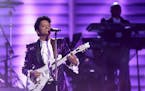 Bruno Mars performs a tribute to Prince at the 59th annual Grammy Awards.