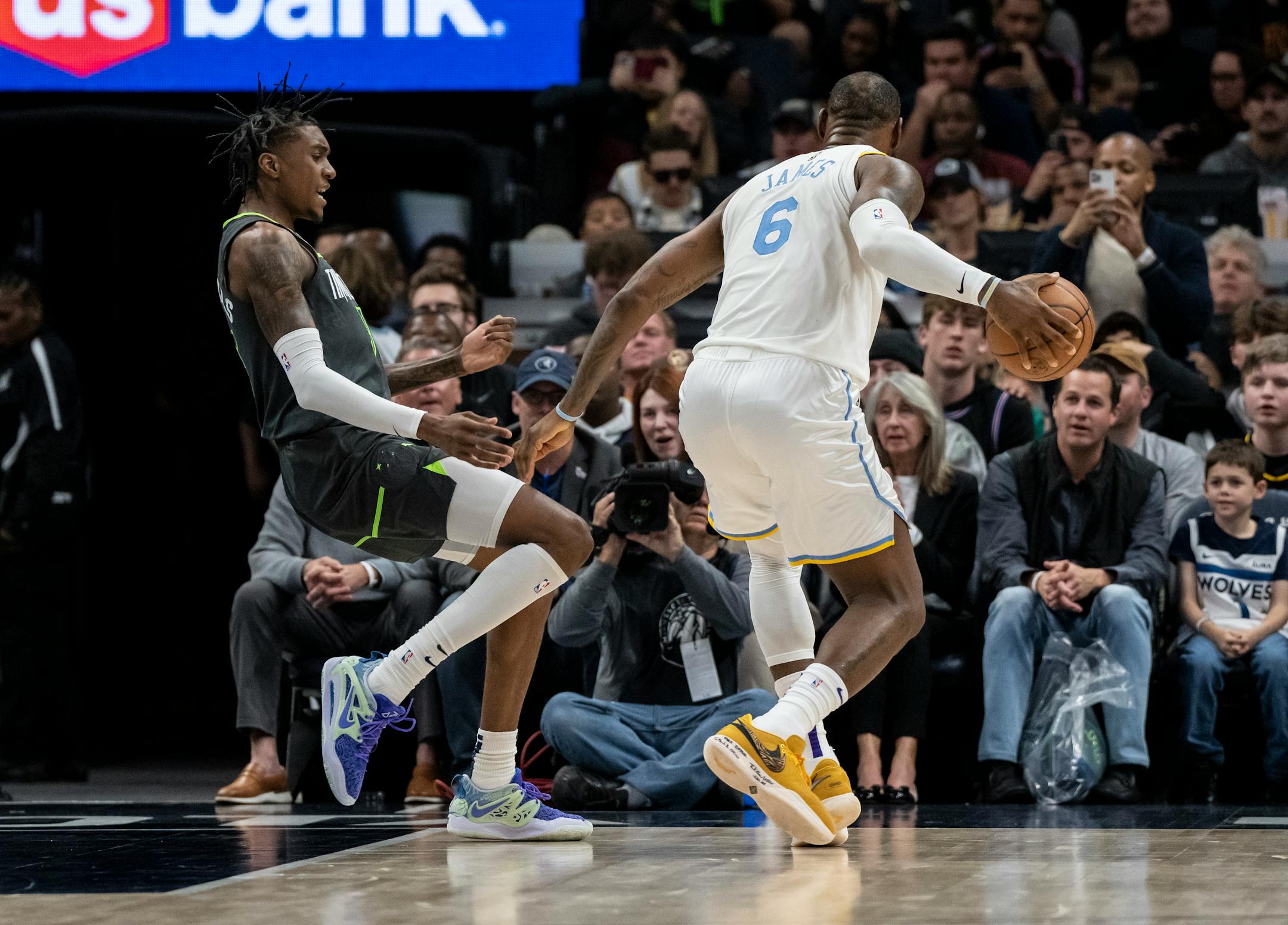 Los Angeles Lakers forward LeBron James (6) knocks down Minnesota Timberwolves forward Jaden McDaniels (3) in the fourth quarter.