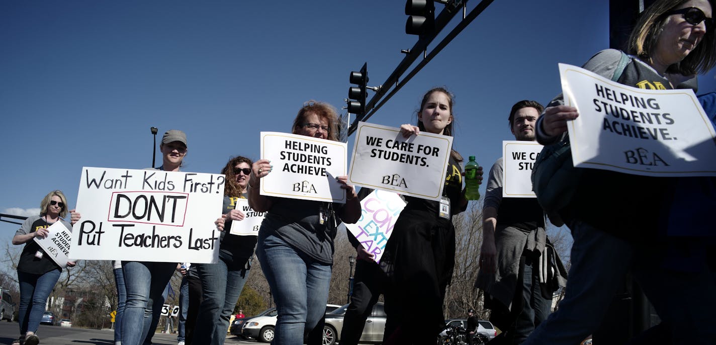 Burnsville teachers picketed this week near the school district office to protest the 300th day without a teaching contact.