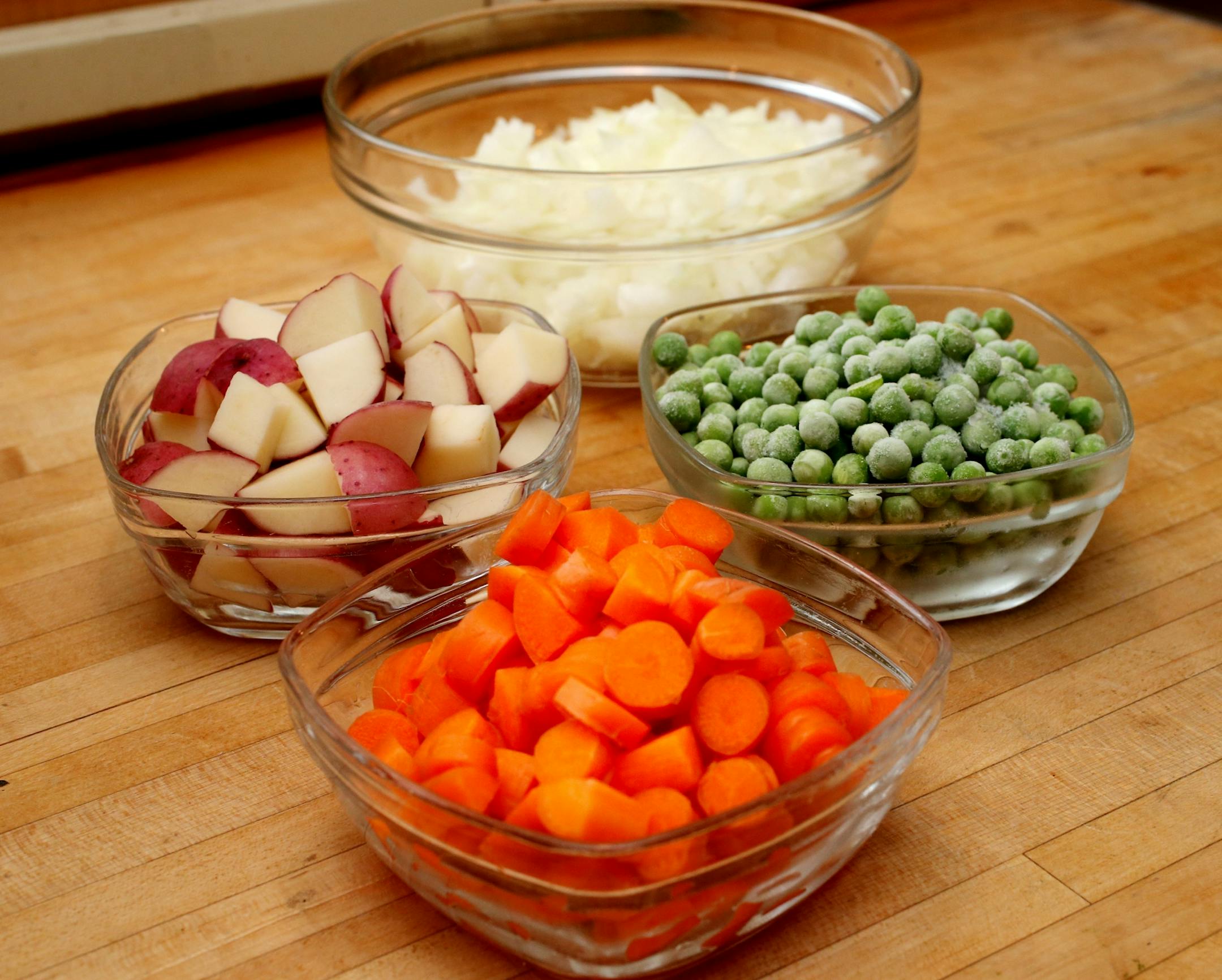 Ingrediants used in making a turkey pot pie. Assembling pastry and filling for individual Turkey Pot Pies in Minneapolis, MN on October 31, 2013.