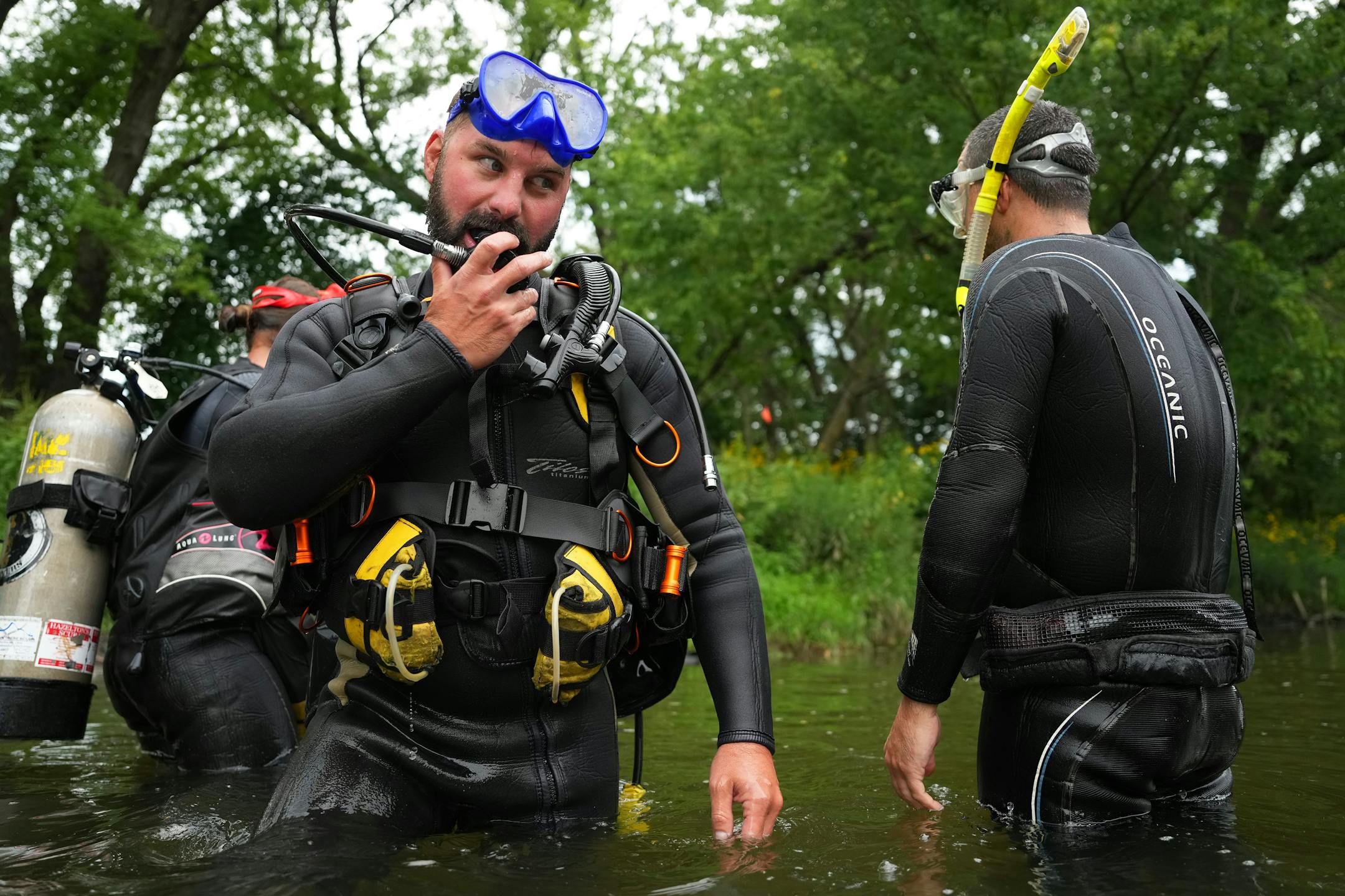 Zeb Secrist, a field mussel biologist with the Minnesota DNR, donned SCUBA gear to survey the population of black sandshell and mucket mussels in a section of the Cedar River.
