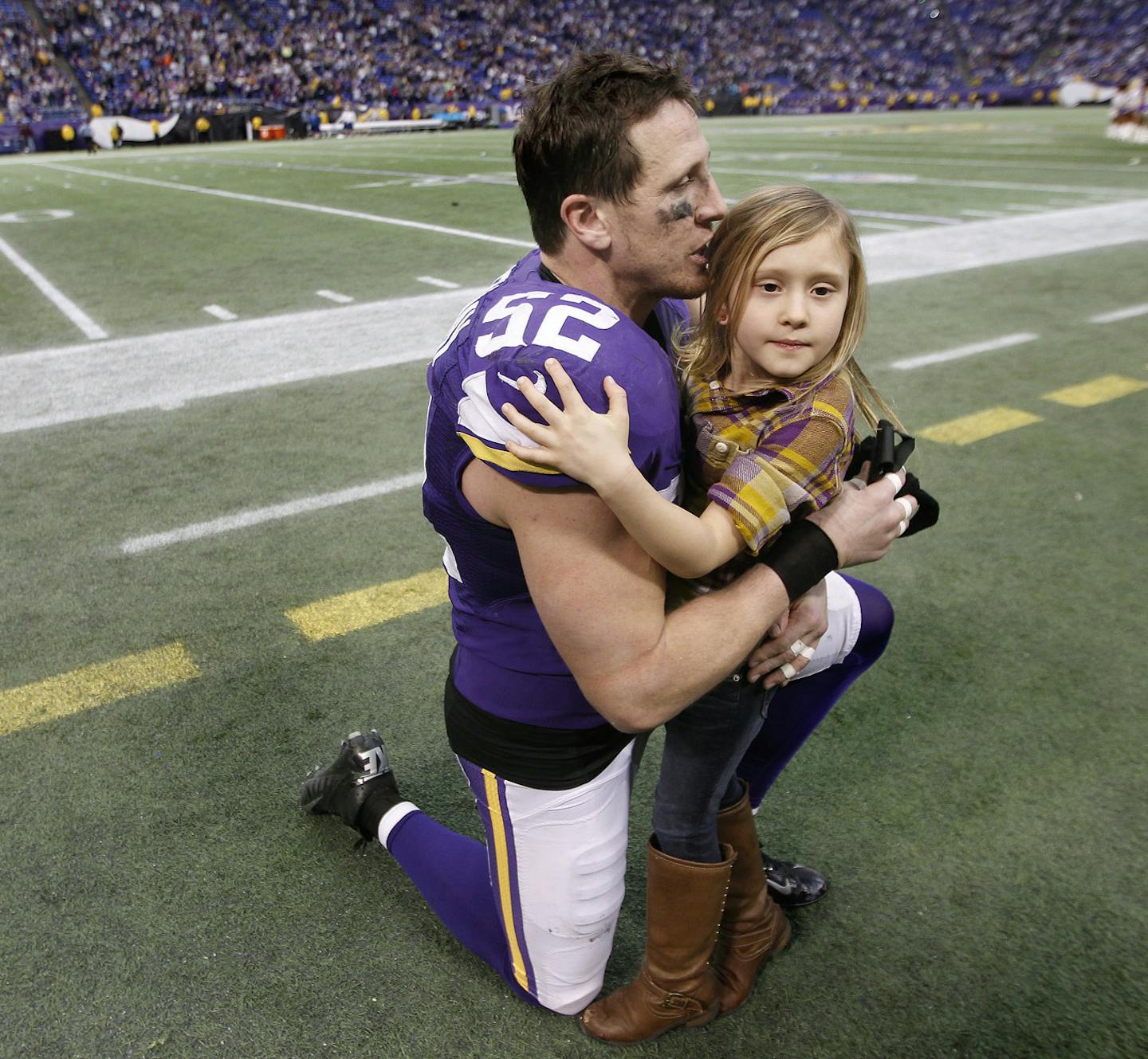 Minnesota Vikings outside linebacker Chad Greenway (52) received a hug and kiss from his daughter Maddyn Greenway, 6, after the Vikings defeated the Lions 14 to 13 at Mall of America Field, Sunday, December 29, 2013 in Minneapolis, MN. (ELIZABETH FLORES/STAR TRIBUNE) ELIZABETH FLORES &#x2022; eflores@startribune.com