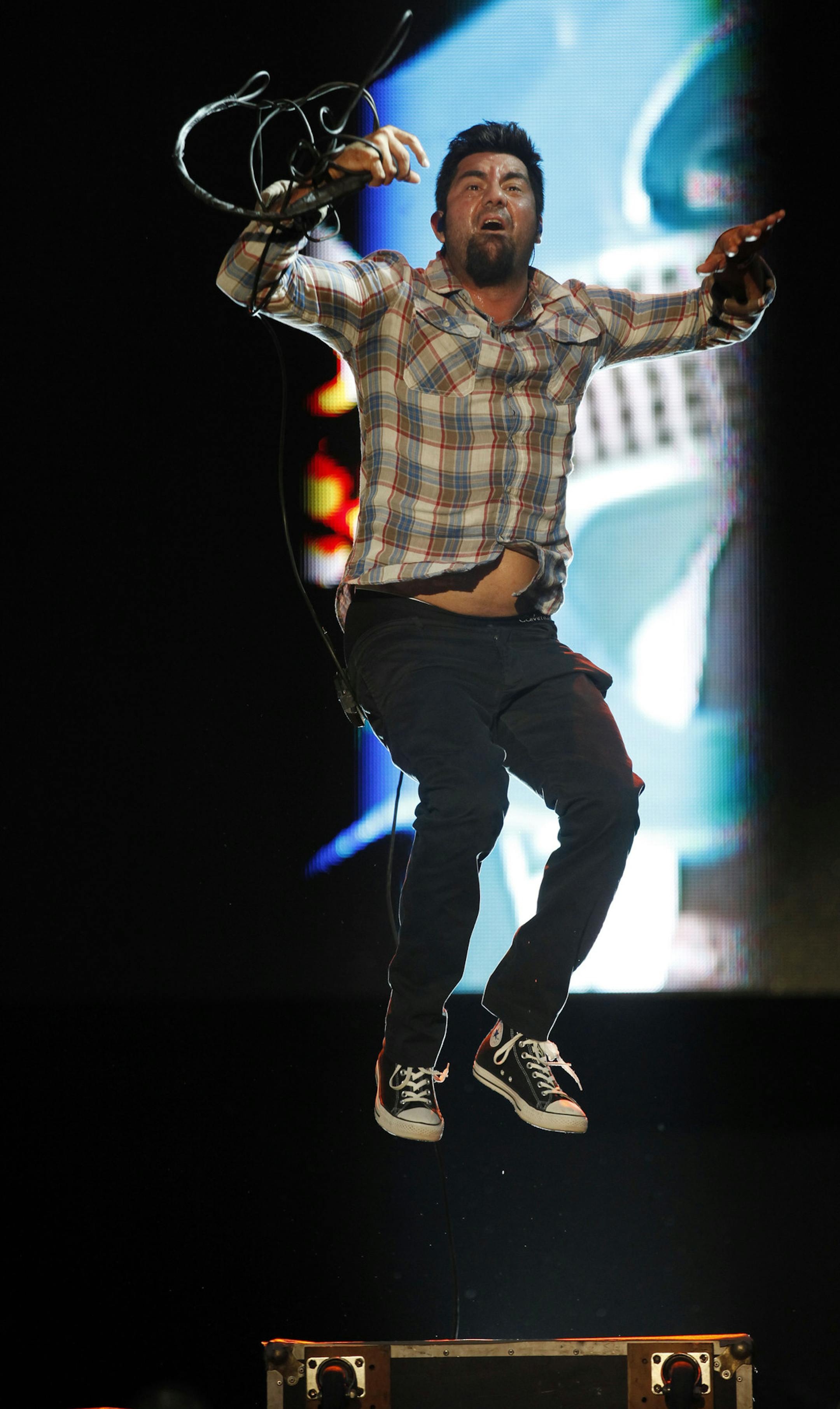 Chino Moreno, lead singer of Californian band Deftones, performs in concert during the Lollapalooza music festival in Santiago, Chile, Saturday April 2, 2011. (AP Photo/Roberto Candia)
