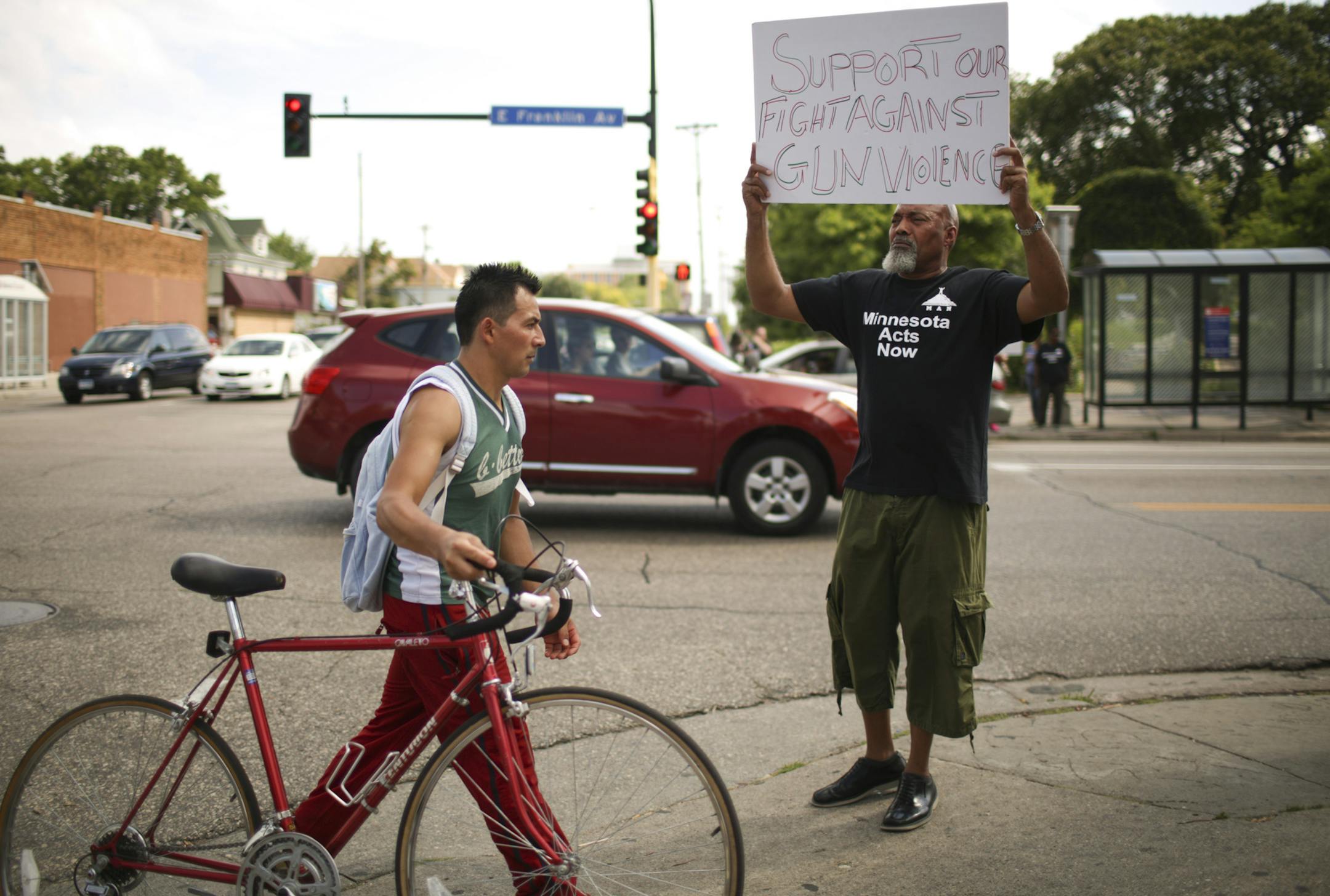 Dennis Williams was among the participants holding signs during the hour-long rally against violence Monday afternoon. ] JEFF WHEELER • jeff.wheeler@startribune.com Pastor Harding Smith and his Minnesota Acts Now organization held a rally to to denounce violence at the corner of Chicago and Franklin Aves. in Minneapolis Monday afternoon, July 27, 2015.