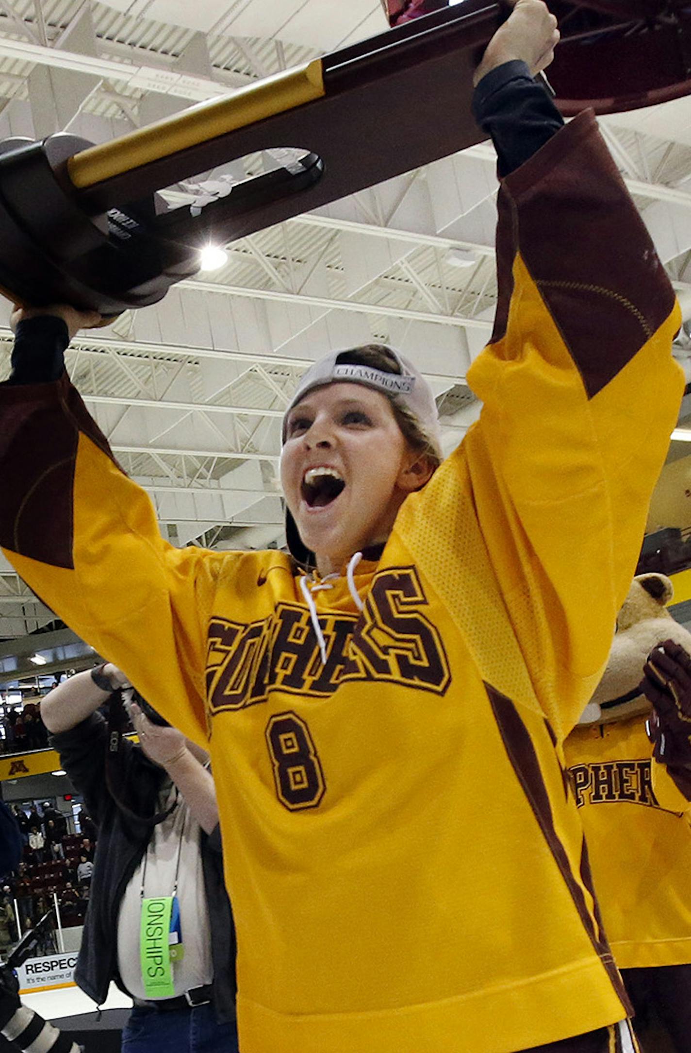 Minnesota's Amanda Kessel (8) celebrates with the National Championship trophy after their game against Boston University Sunday March 24, 2013 in Minneapolis. Minnesota beat Boston University by a final score of 6-3 to win the NCCA National Championship. (AP Photo/Star Tribune, Carlos Gonzalez) ORG XMIT: MIN2013032514144839 ORG XMIT: MIN1303251417320656