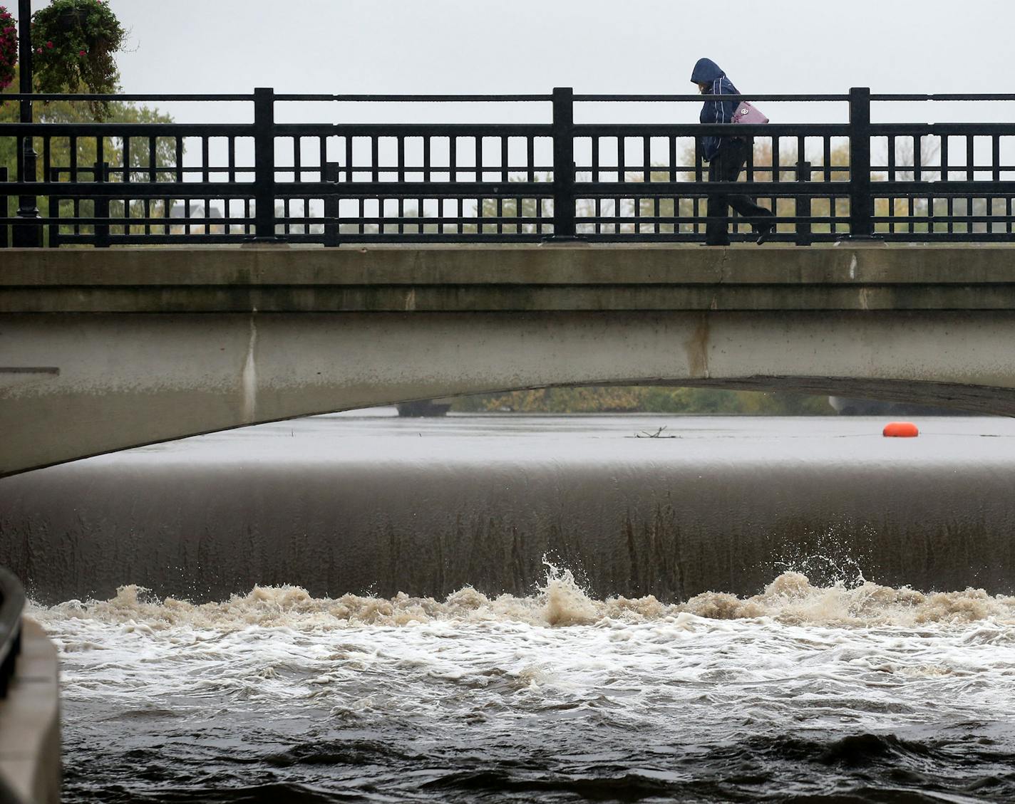 High water cascades over the Ames Mill Dam on the Canon River as a pedestrian crosses the South Water Street Bridge Wednesday, Oct. 2, 2019, in downtown Northfield, MN.] DAVID JOLES &#x2022; david.joles@startribune.com Enough already. It's been one wet autumn in one wet year in one wet decade, and waterlogged cities and towns from Warroad to Winona long to dry out. But as the rain keeps coming and the first frost nears, that may not happen until next spring, at the earliest. We check in on recor