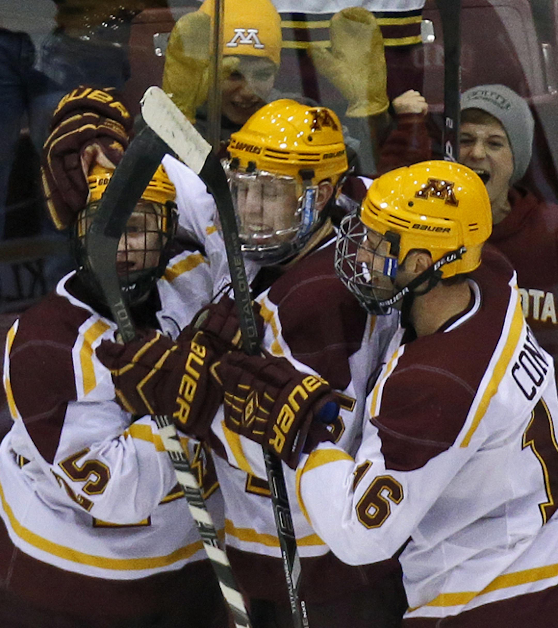 UM Gophers vs. UMD Bulldogs hockey. Fans and Gophers players celebrated with Justin Kloos, left, after he scored a goal in first period action. (MARLIN LEVISON/STARTRIBUNE(mlevison@startribune.com)
