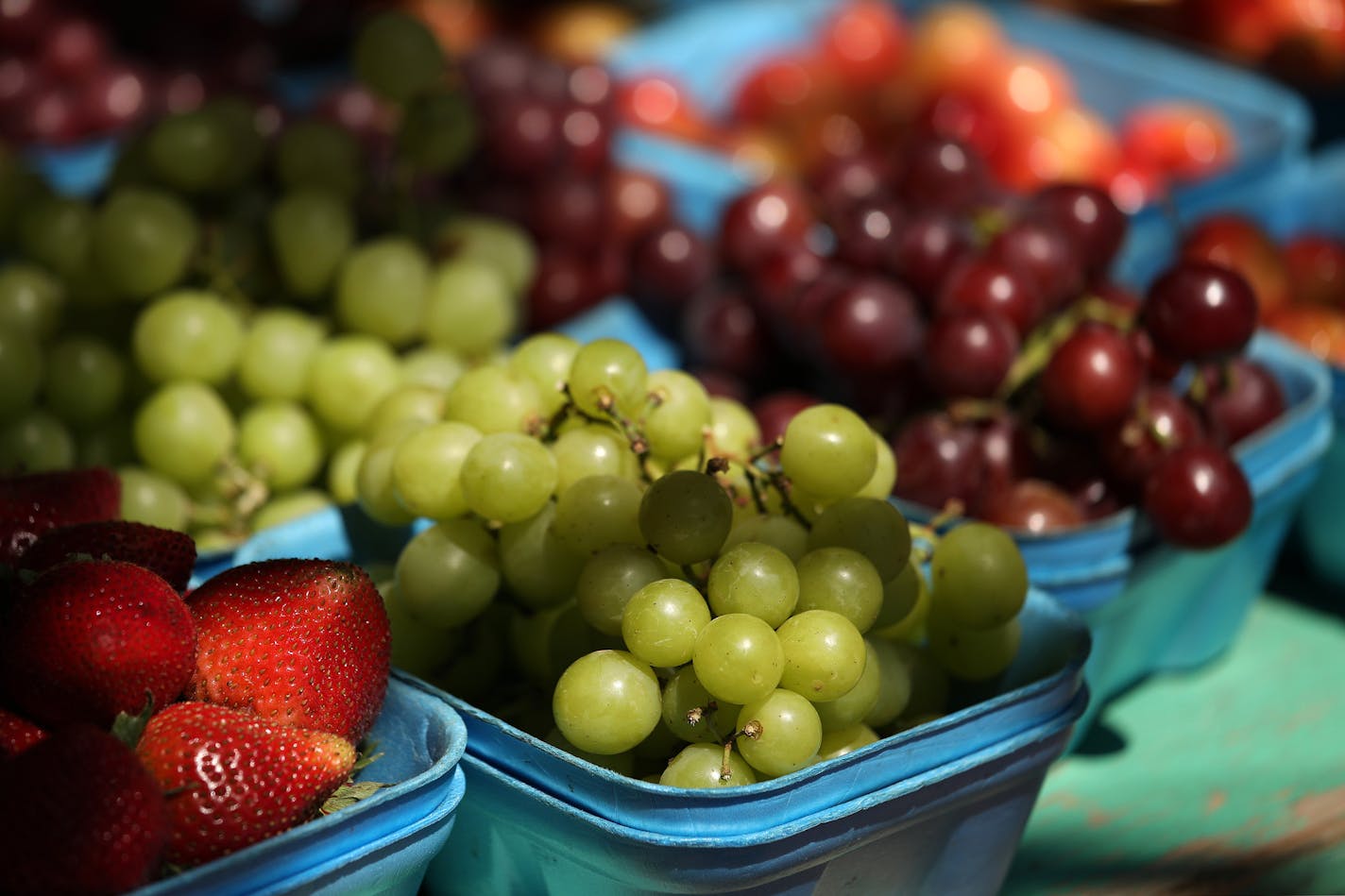 Strawberries, grapes, cherries, and other produce sat out for sale at the Patnode's stand, which workers say is the oldest at the farmers market. ] ANTHONY SOUFFLE &#x2022; anthony.souffle@startribune.com Vendors sold their goods from stands during the Downtown Farmers Market Thursday, June 1, 2017 at the Location Hennepin County Government Center South Plaza in Minneapolis