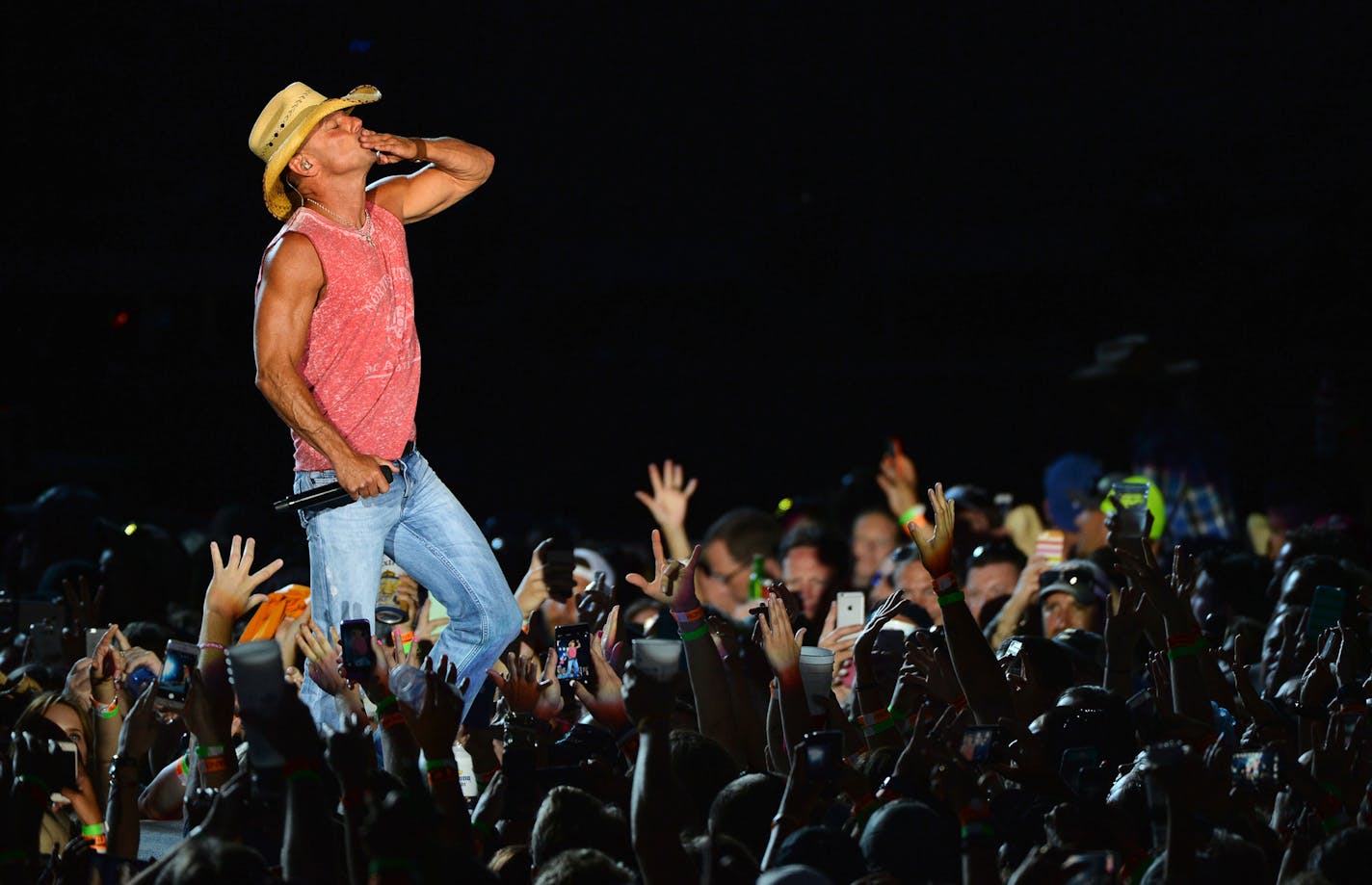 In this file photo, Kenny Chesney gave his fans some love Saturday in an amped-up performance at Target Field in Minneapolis.