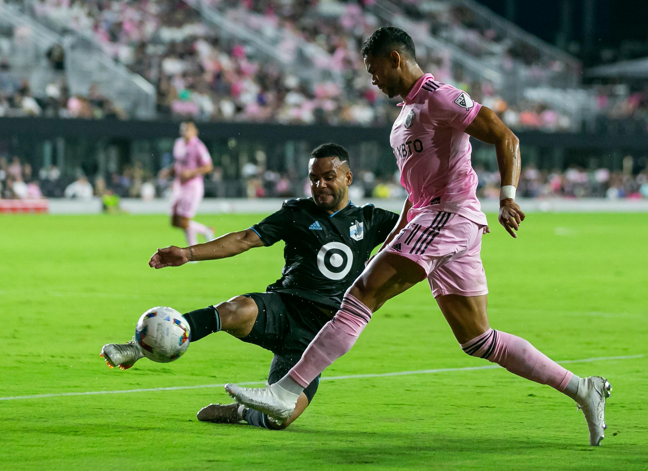 Inter Miami forward Ariel Lassiter, right, kicks the ball past Minnesota United defender D.J. Taylor during the first half Saturday