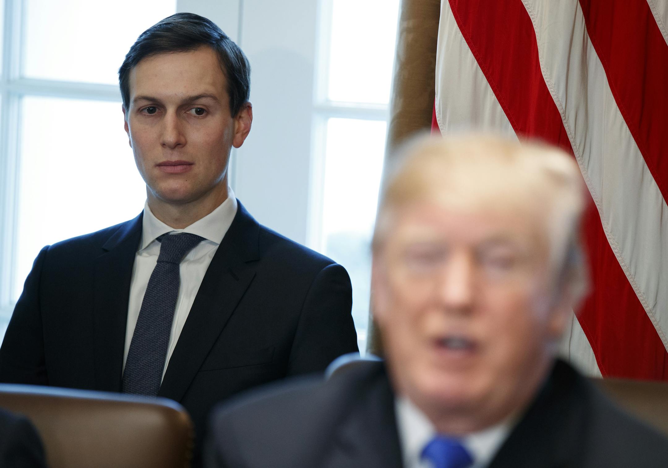 FILE - In this Dec. 20, 2017 file photo, White House senior adviser Jared Kushner listens as President Donald Trump speaks during a cabinet meeting at the White House in Washington. Kushner has lost his access to the nation’s deepest secrets, which could be problematic in his role overseeing the Trump administration’s efforts to produce Mideast peace. (AP Photo/Evan Vucci)