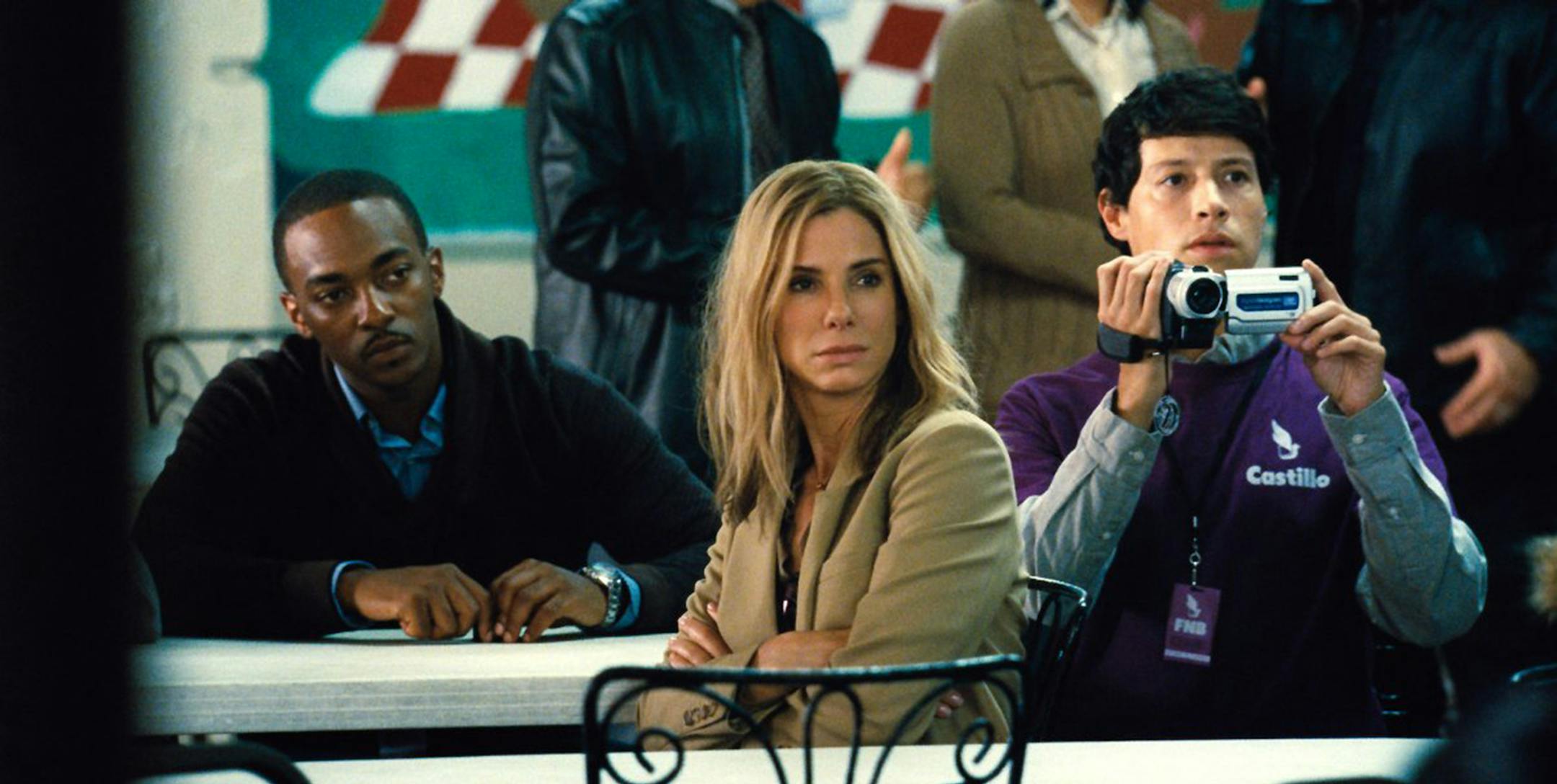 Anthony Mackie, Sandra Bullock and Reynaldo Pacheco in "Our Brand Is Crisis." (Photo courtesy Warner Bros. Pictures/TNS) ORG XMIT: 1175598