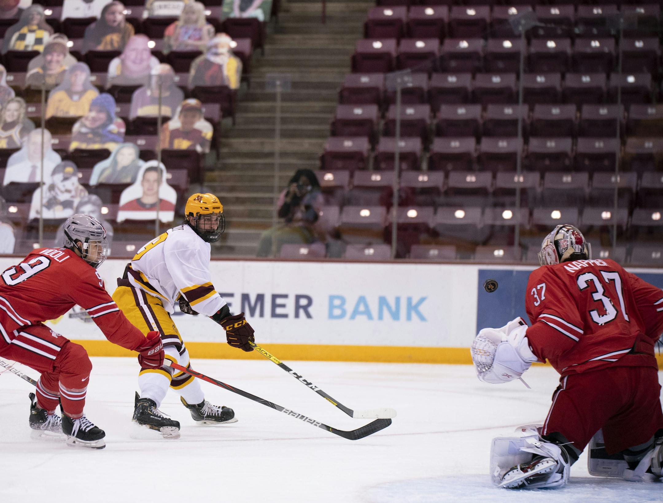 Gophers forward Scott Reedy eluded the Buckeyes' Dominic Vidoli to put a backhander past Ohio State goaltender Tommy Nappier on Tuesday night. Minnesota won 2-0 to sweep the series.