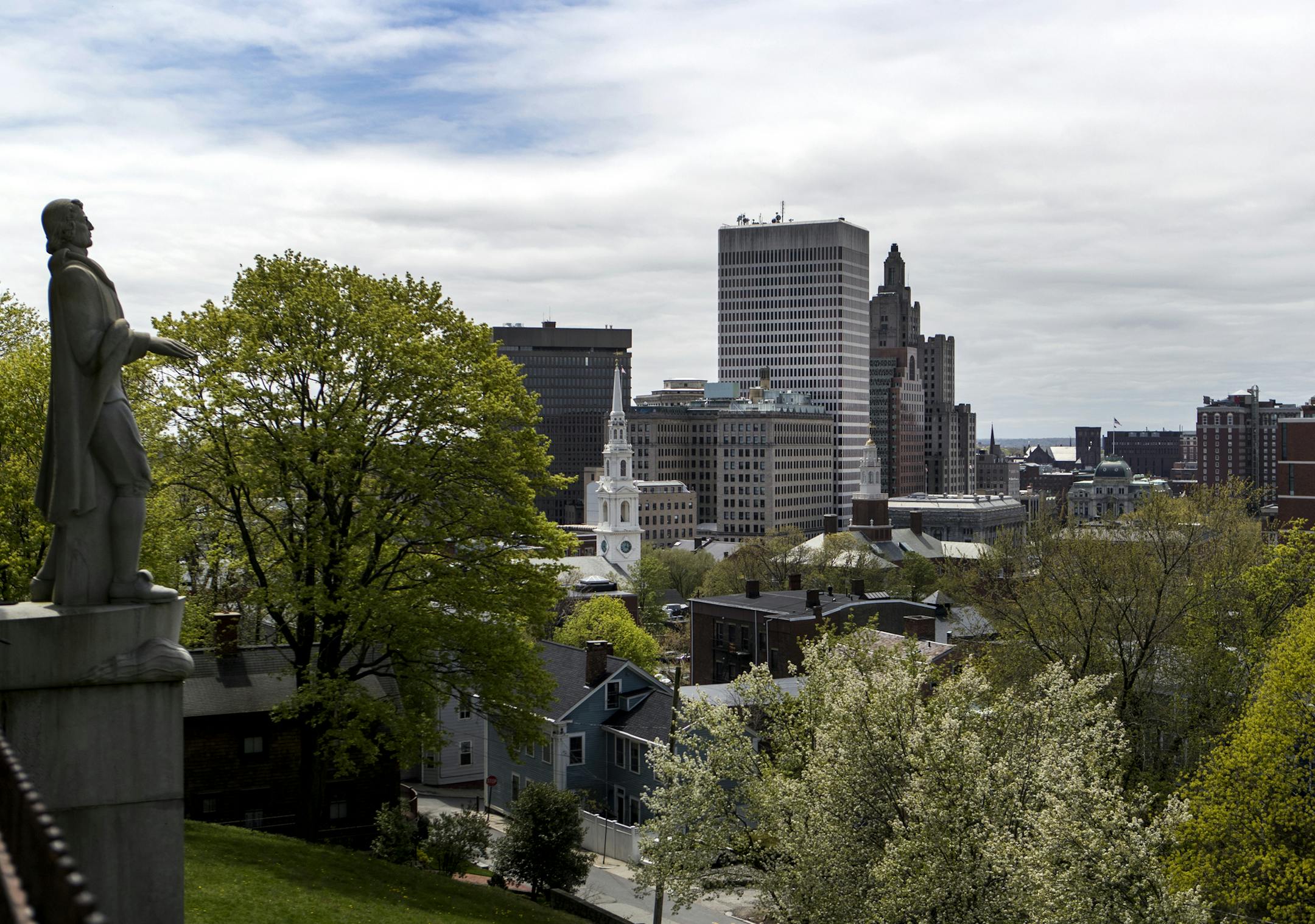 A statue of Roger Williams overlooks the Providence skyline seen from Prospect Terrace in the College Hill neighborhood in Providence, Rhode Island, on May 3, 2019. MUST CREDIT: Photo for The Washington Post by Ruby Wallau
