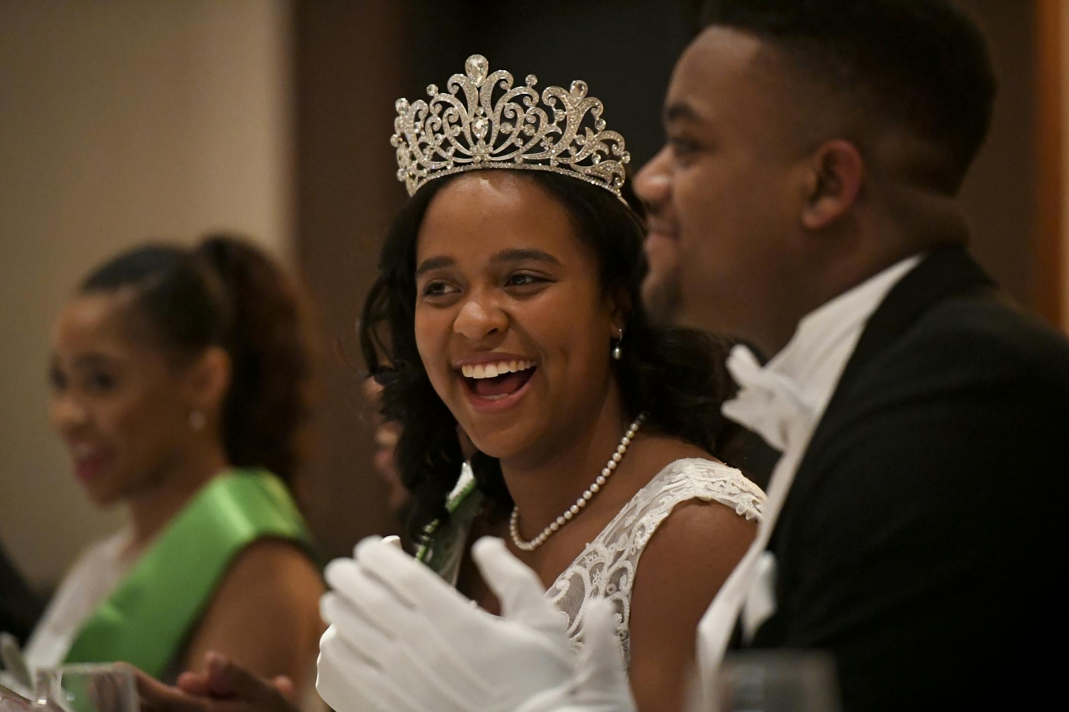 Morgan Phillips, a senior at The Blake School, sat with her escort, Noah Layton, after Phillips was crowned cotillion queen.