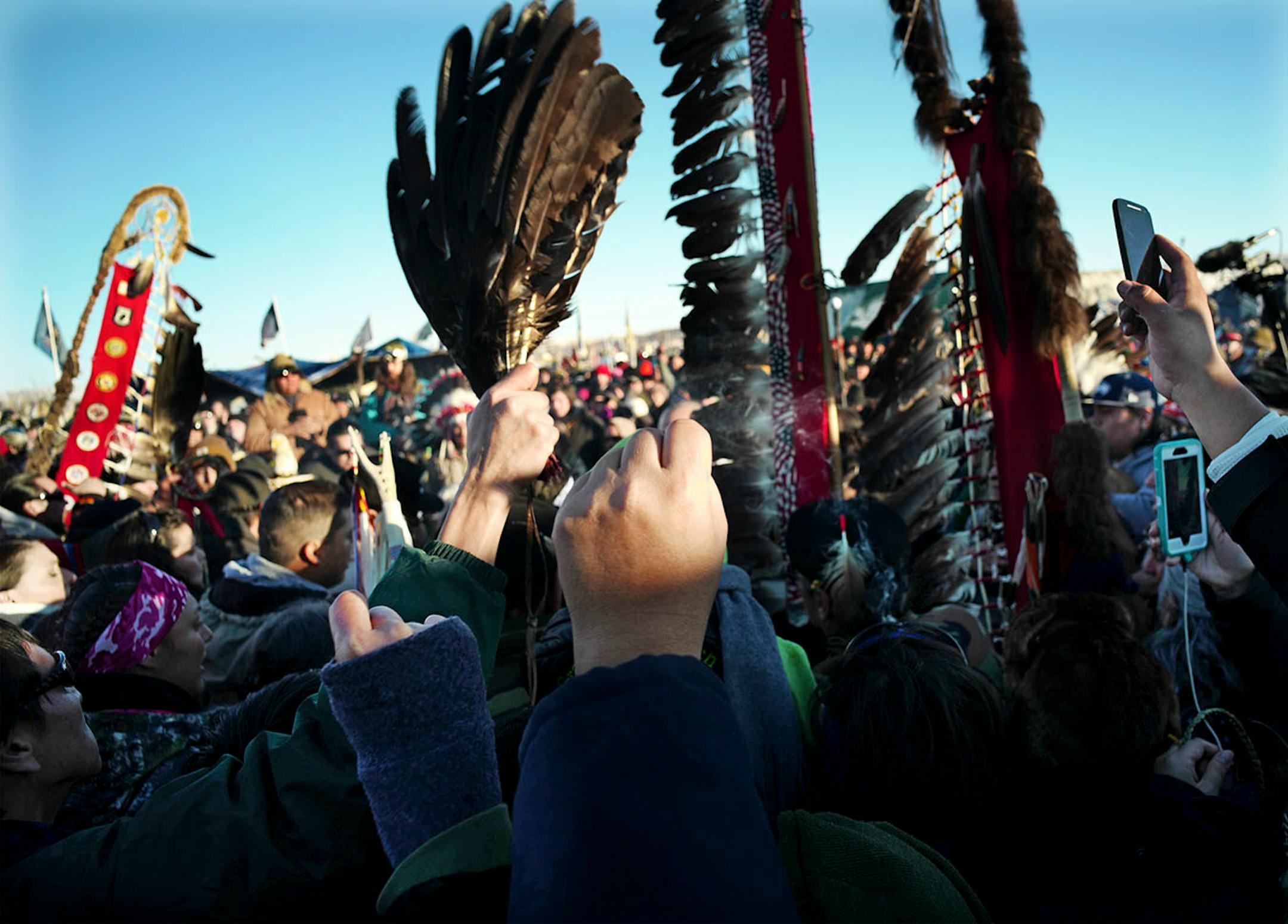 At Oceti Sakowin Camp, protesters celebrated Sunday after the Army Corps of Engineers delayed an easement for the Dakota Access Pipeline to drill under Lake Oahu.