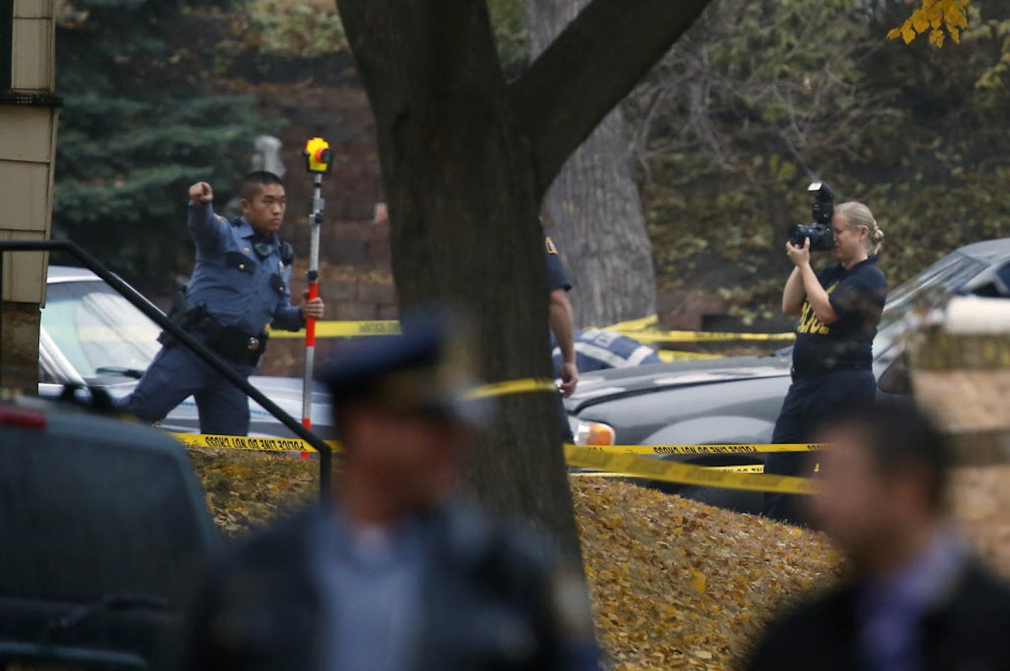 Crime lab officials investigated the scene on the corner of Jessamine Ave and Westminster St. in St. Paul where a man was shot to death by police. It was the first of two fatal shooting incidents involving St. Paul police on Tuesday.