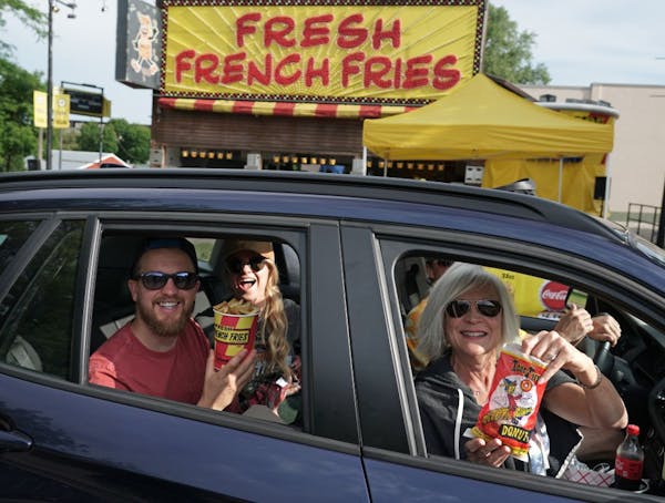 The Minnesota State Fair Food Parade got underway Thursday. David, Jessica, John and Jill Fredrickson were one of the first cars to enter the parade, 