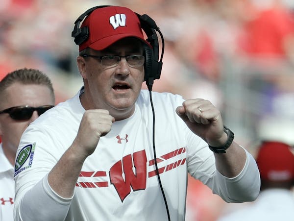 FILE - In this Sept. 30, 2017, file photo, Wisconsin head coach Paul Chryst reacts after a touchdown during the first half of an NCAA college football