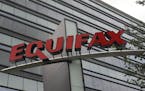 This Saturday, July 21, 2012, photo shows signage at the corporate headquarters of Equifax Inc. in Atlanta. New York Attorney General Eric Schneiderma