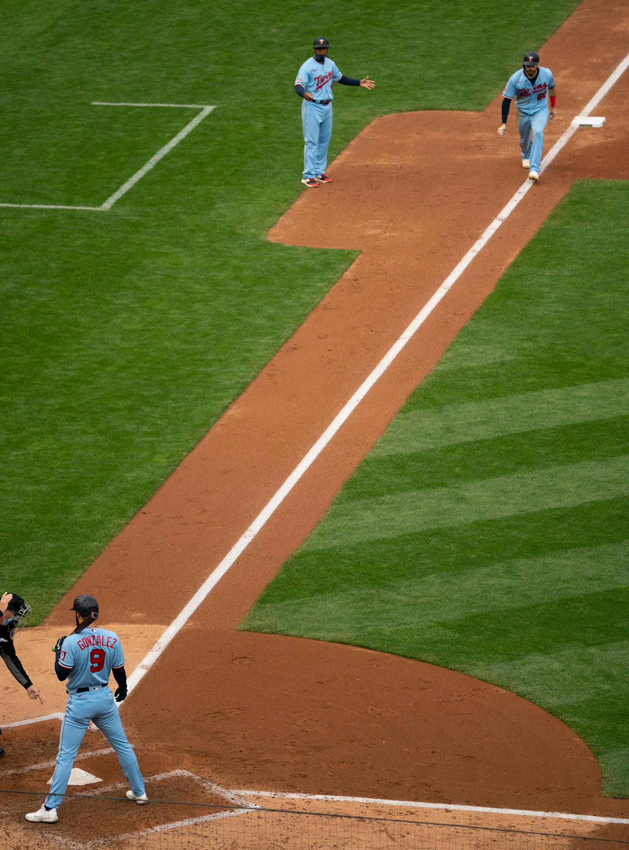 With Minnesota Twins third baseman Marwin Gonzalez (9) batting, the home plate umpire pointed to the plate and sent Minnesota Twins center fielder Jake Cave (60) home from third base on a balk by Cincinnati Reds starting pitcher Sonny Gray (54) in the fifth inning.