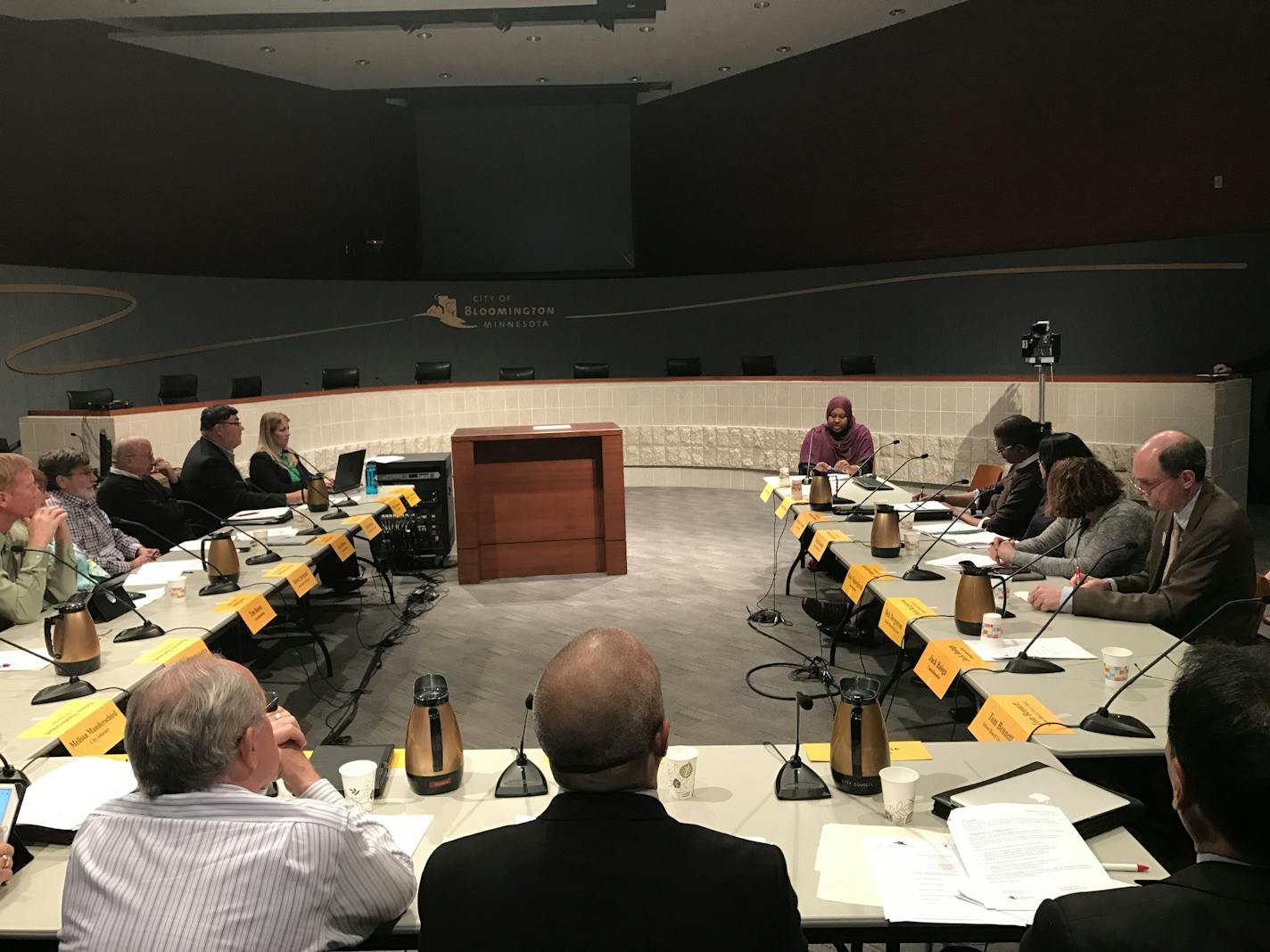 Hodan Hassan, top right, addresses the Bloomington City Council and school board at Bloomington City Hall on Tuesday night. The administrations read a joint statement supporting the city's immigrant community.