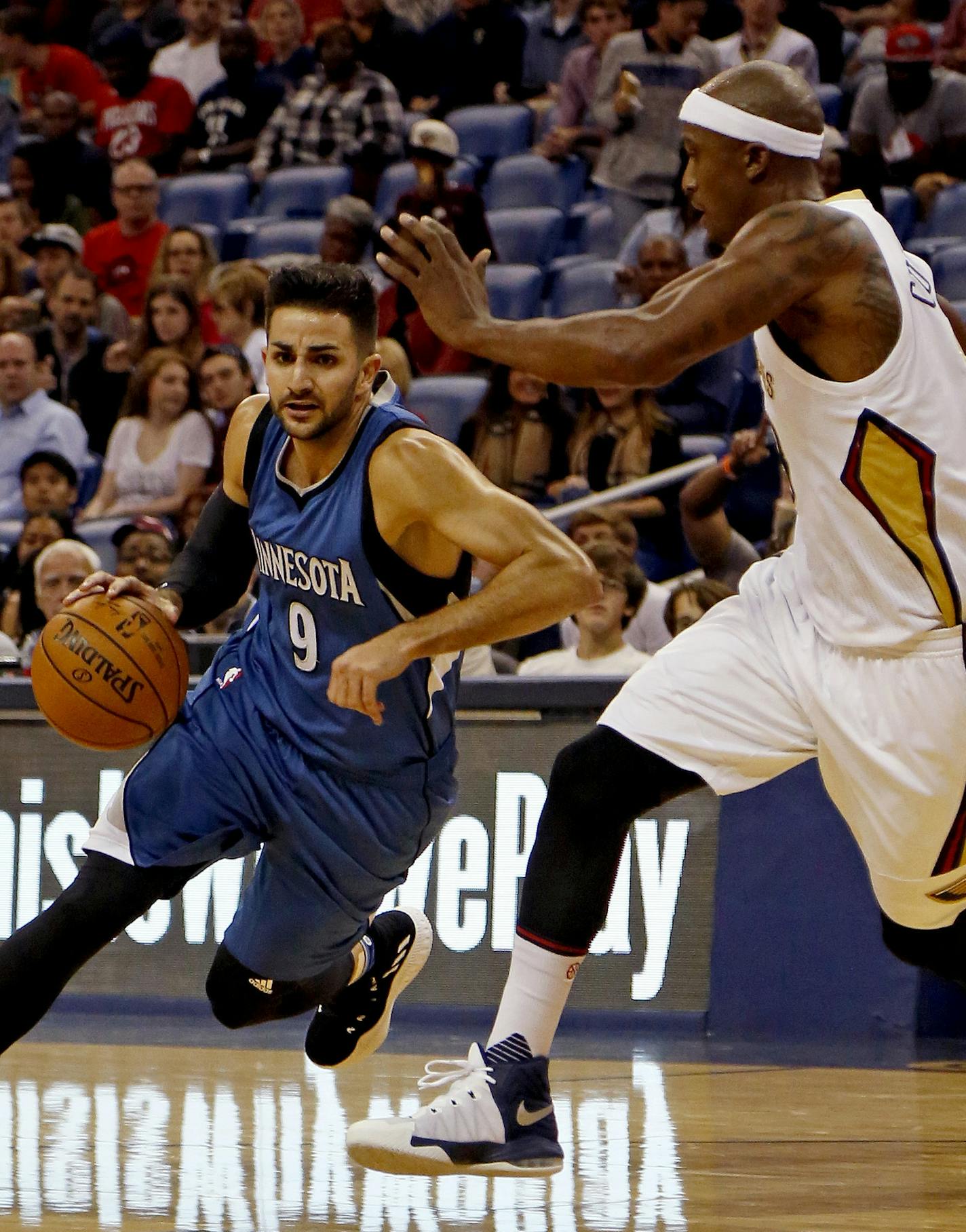 Minnesota Timberwolves guard Ricky Rubio (9) drives to the basket against New Orleans Pelicans forward Dante Cunningham during the first half of an NBA basketball game in New Orleans, Wednesday, Nov. 23, 2016. (AP Photo/Max Becherer)