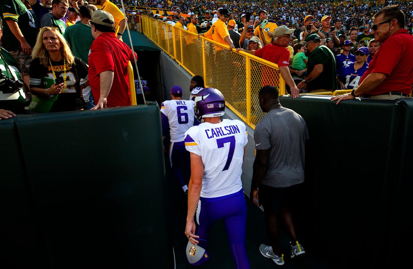 Daniel Carlson walked off the field after missing a field goal that would have beaten the Packers. He was cut before the next game.