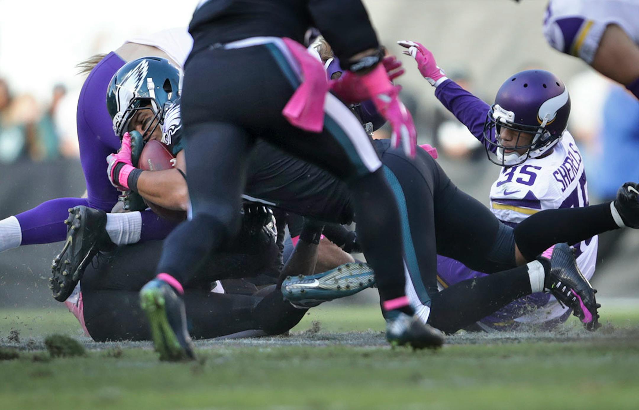 Vikings Marcus Sherels (right) looks up after fumbling a punt return in the 3rd quarter. Recovered by Eagles Trey Burton (left).